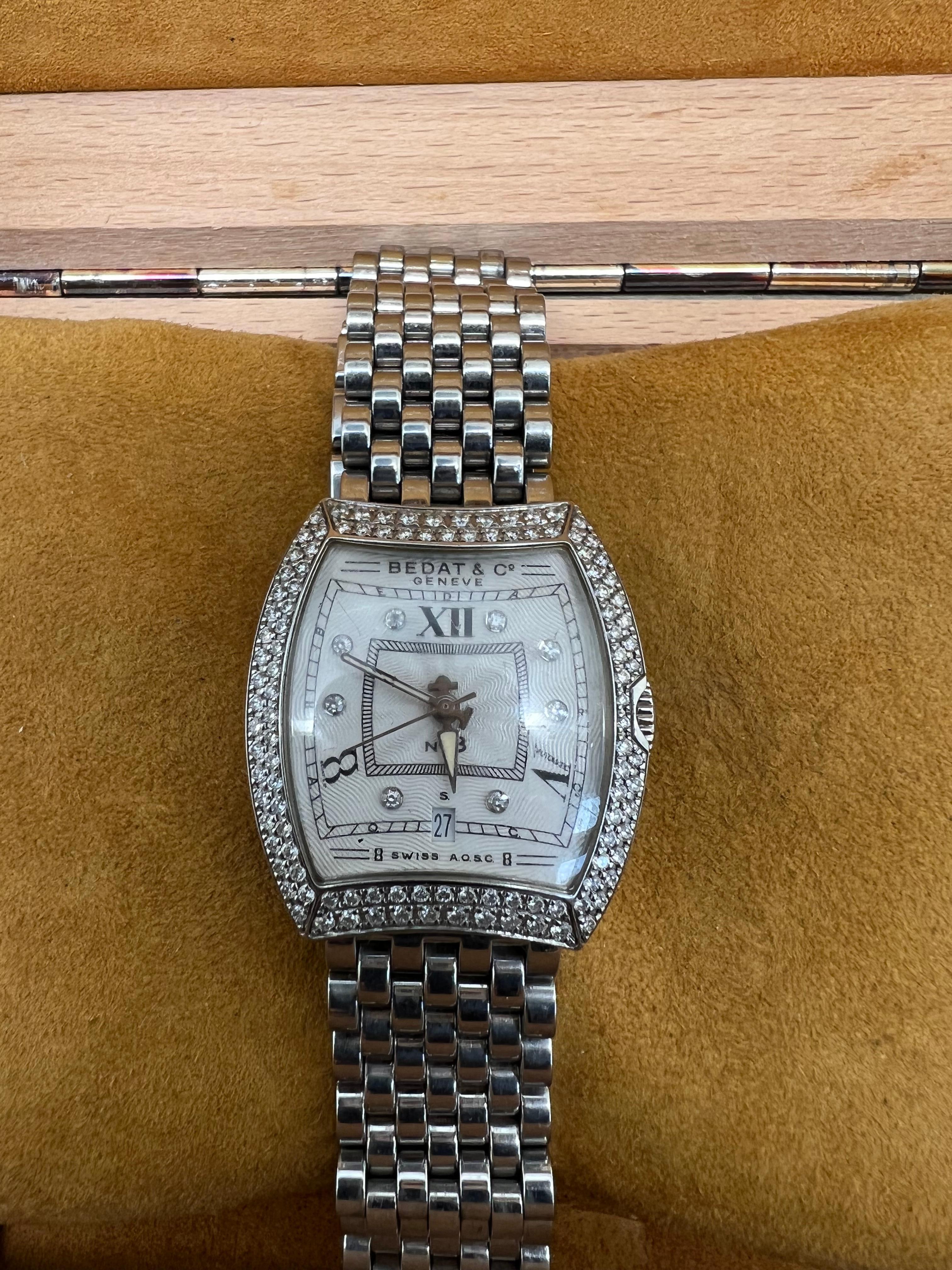 Bedat & Co. ladies wrist watch reference 314 No. 3 with all original parts. Tonneau-shaped 28mm case fitted with 113 round diamonds (0.95 carats). Textured sunburst guilloche dial with blue hands, Roman numeral hour-markers, and meticulously crafted