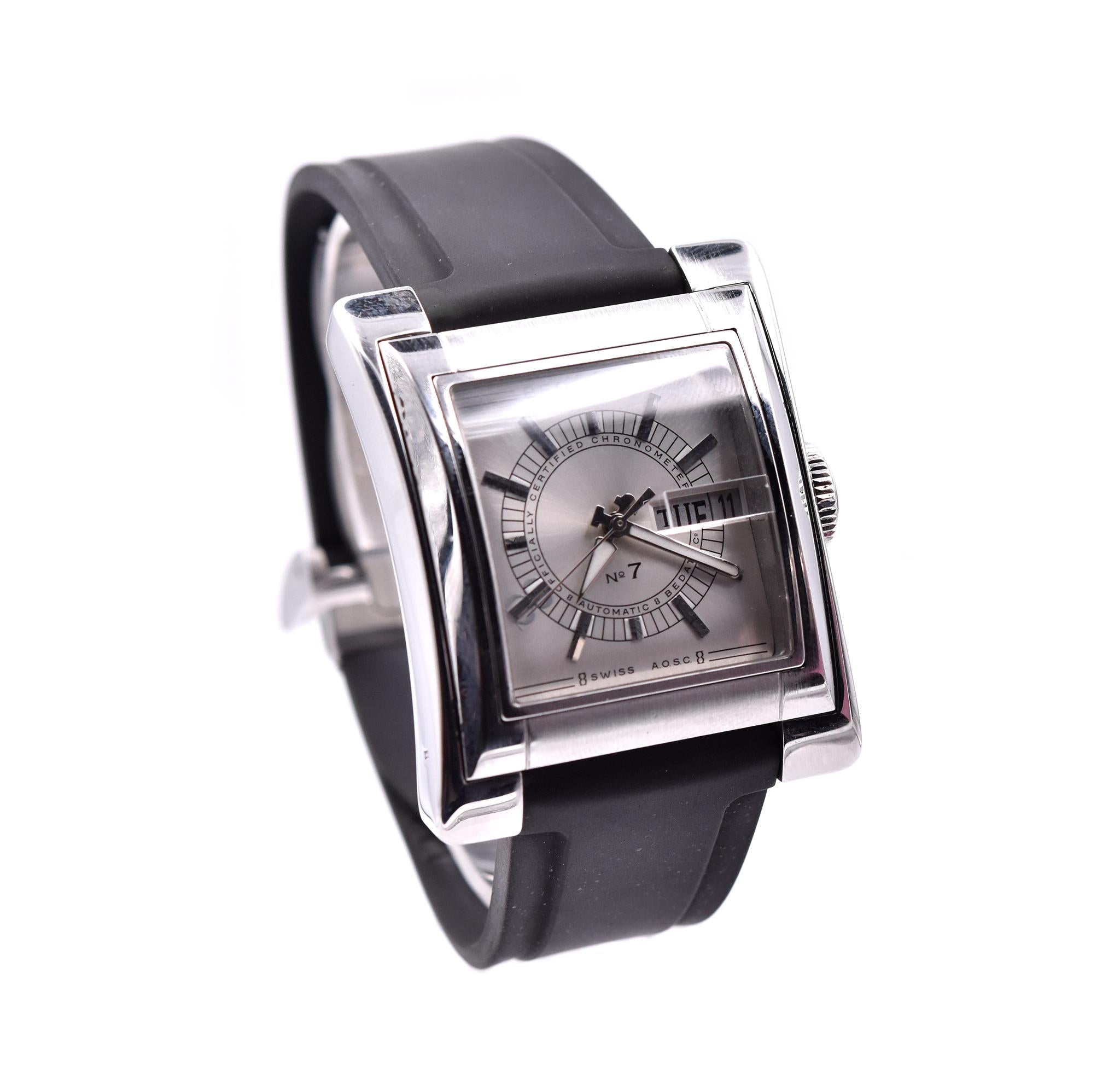 Movement: automatic
Function: hours, minuets, seconds, date, day
Case: 48 X 39mm rectangular stainless steel case, sapphire crystal
Bracelet: black rubber strap, integrated clasp 
Dial: silver dial
Reference #: 797
Serial # 0XXX

No box and