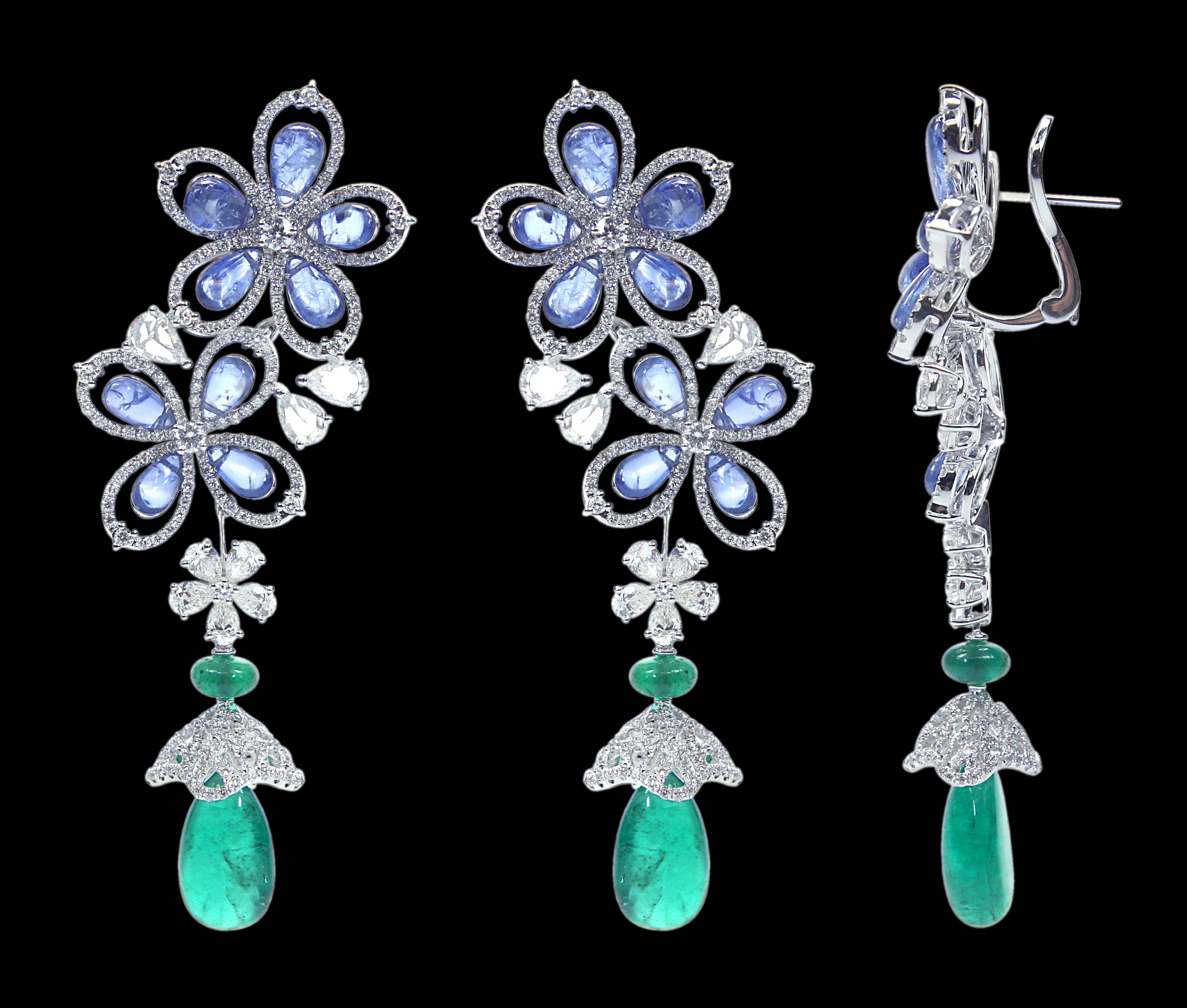 Bedazzling 18 Karat White Gold , Diamond, Sapphire And Emerald Drop Set .

Earrings: 
Diamonds of approximately 5.485 carats, sapphires approximately of 11.360 carats and emeralds of approximately 12.390 carats, mounted on 18 karat white gold