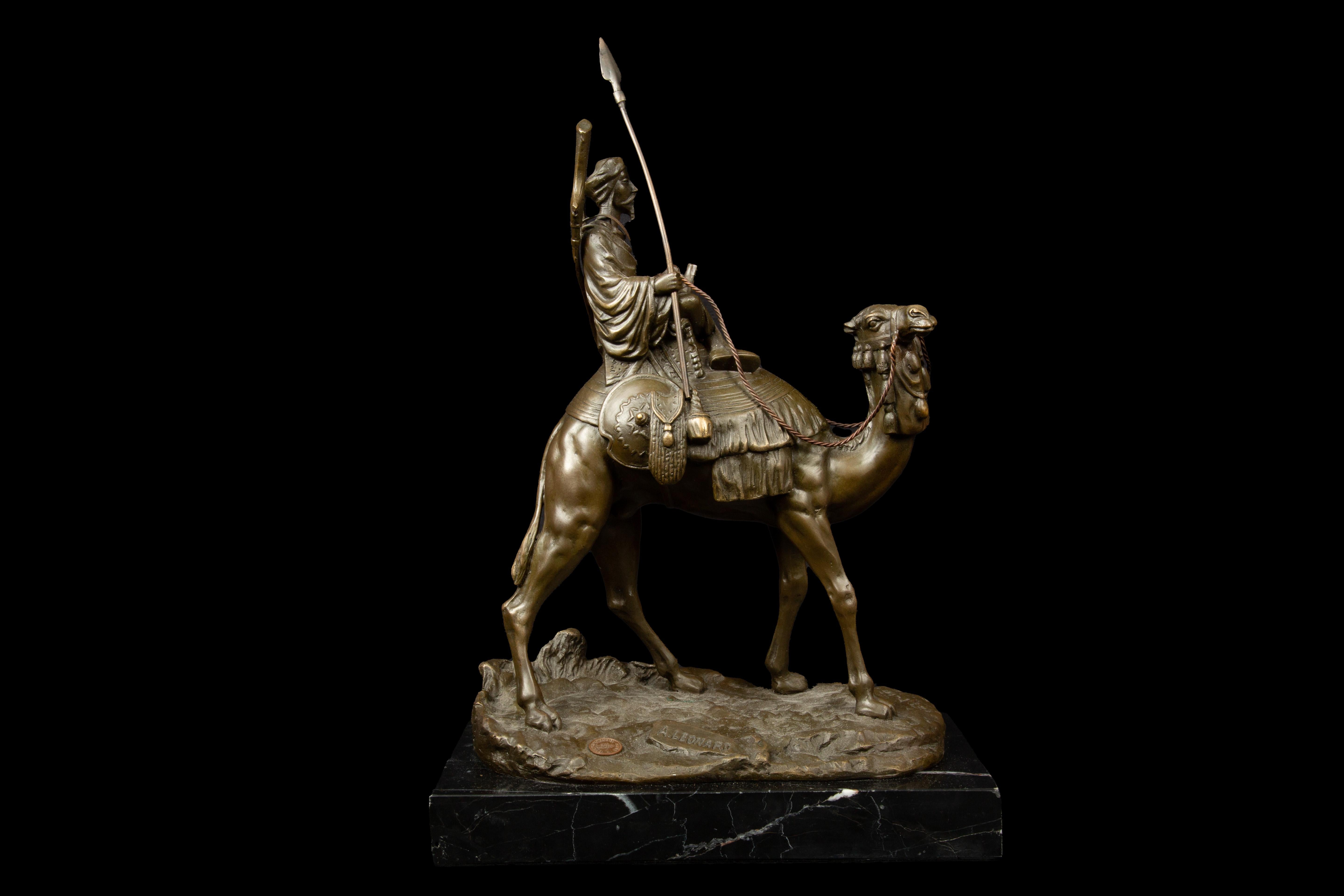 Agathon Léonard (1841-1923) Bedouin on a Camel mounted on a black marble base. This exceptional sculpture, cast in bronze with a captivating brown patina, showcases Léonard's unparalleled talent and artistic vision. Expertly crafted, this artwork
