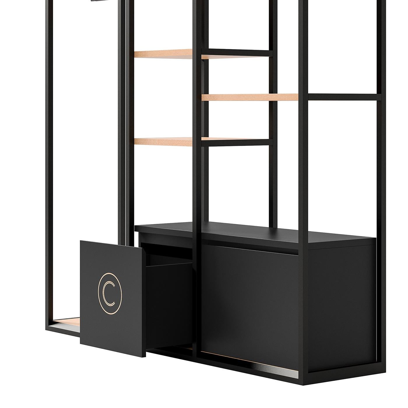 The Minimalist flair and floating appearance of this sophisticated shelving unit will add style to a modern and Minimalist bedroom. This eclectic piece is framed in black-finished metal with light veneered shelves and comprises three sections, each