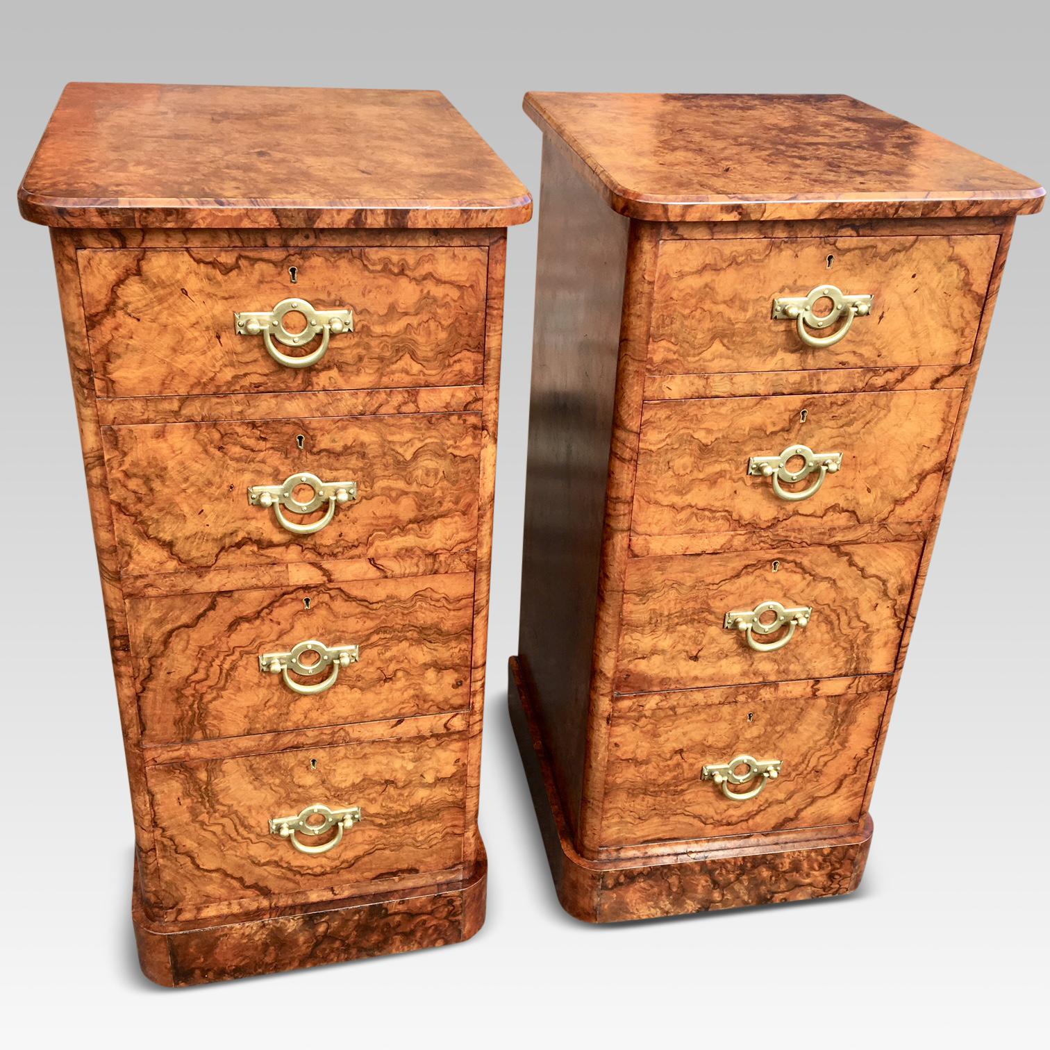 Fine quality pair of English figured walnut bedside cabinets with original brass handles, circa 1880.

These stunning cabinets are 34.5 ins high, 16.5 ins wide and 18 ins deep. There are four smoothly running drawers to each cabinet, all beautifully