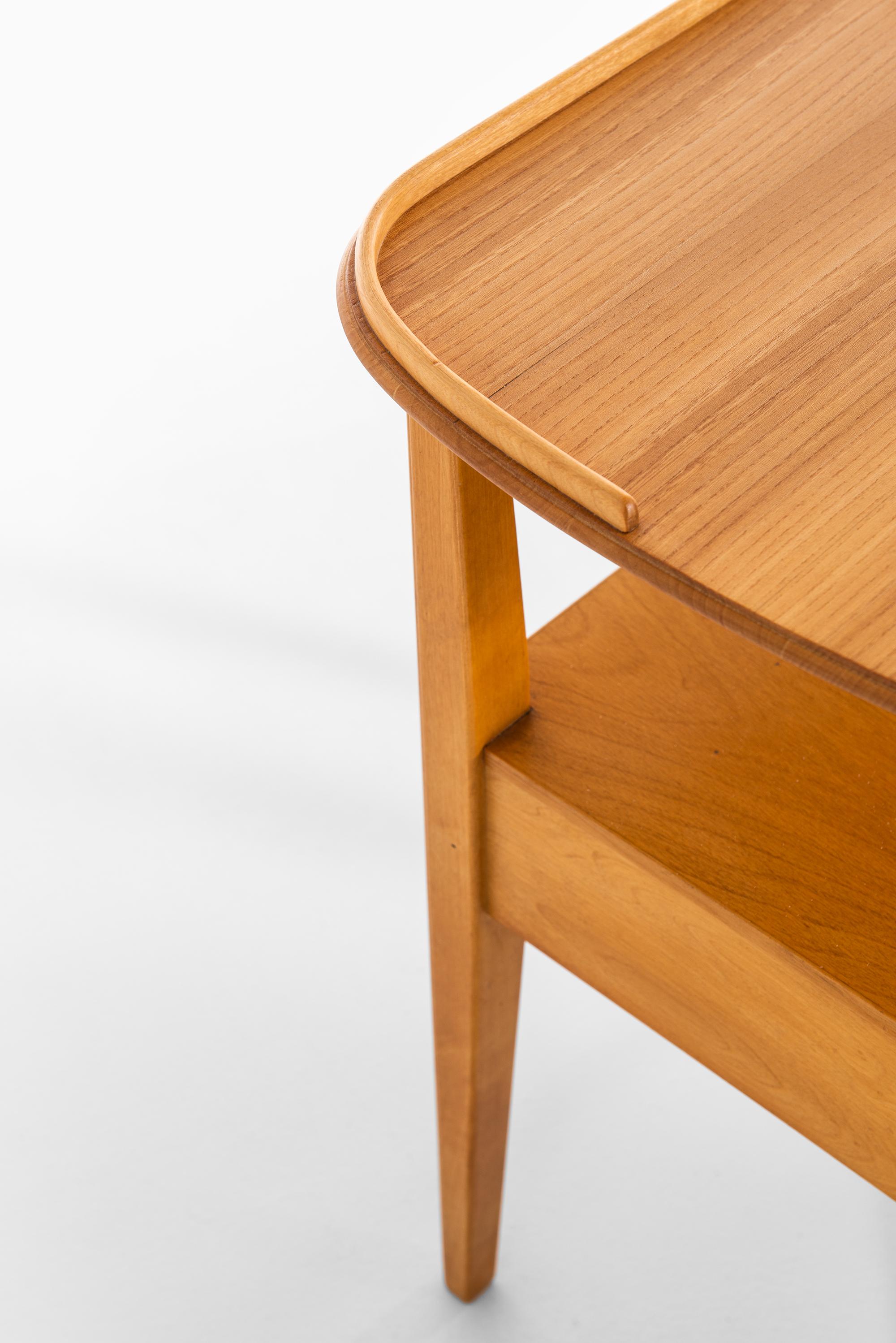 A pair of bedside tables / side tables. Produced by NK (Nordiska Kompaniet) in Sweden.