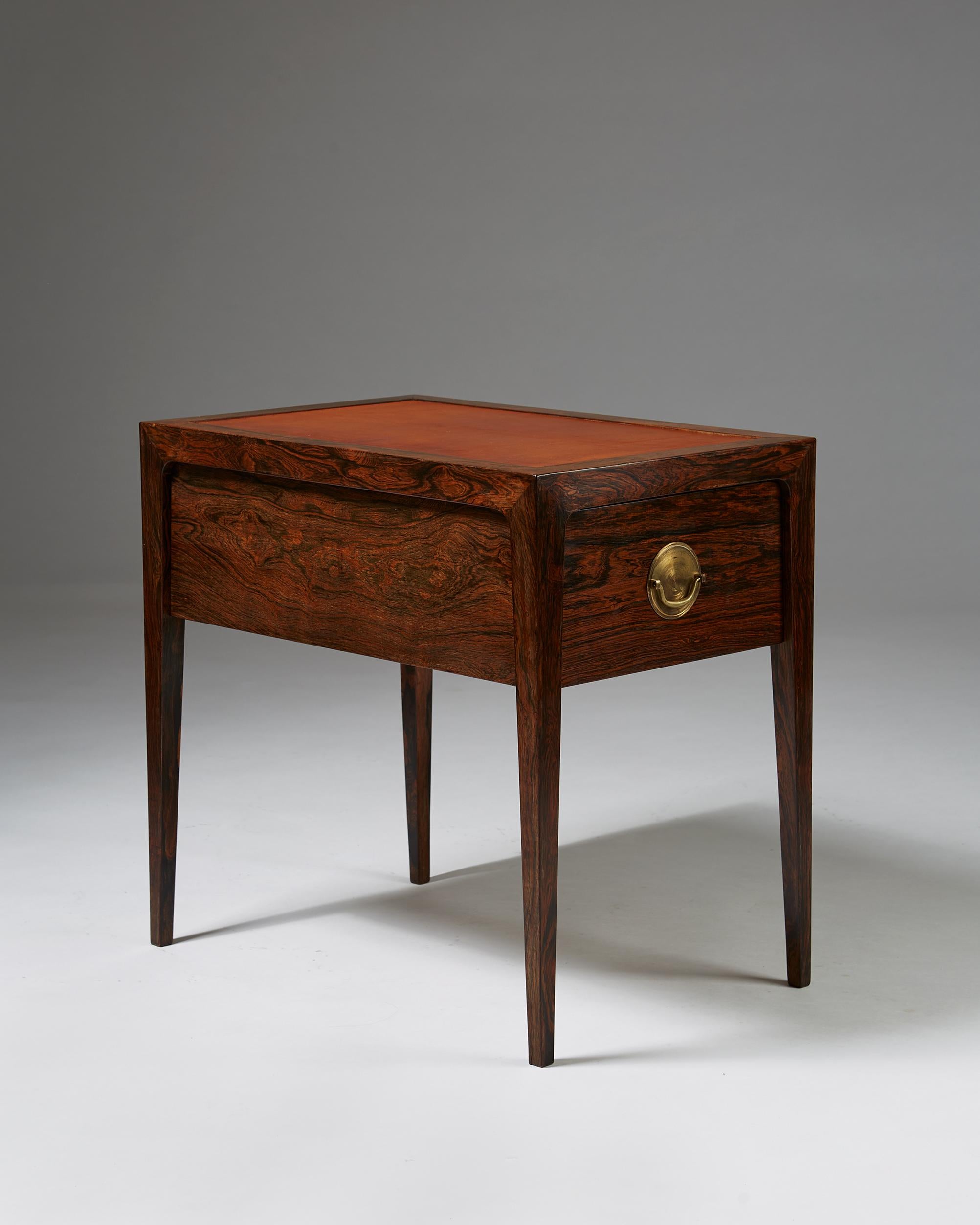 Bedside table designed by Helge Brandt, Denmark, 1963. 

Rosewood and leather.

Dimensions: 
H: 55 cm/ 21 2/3