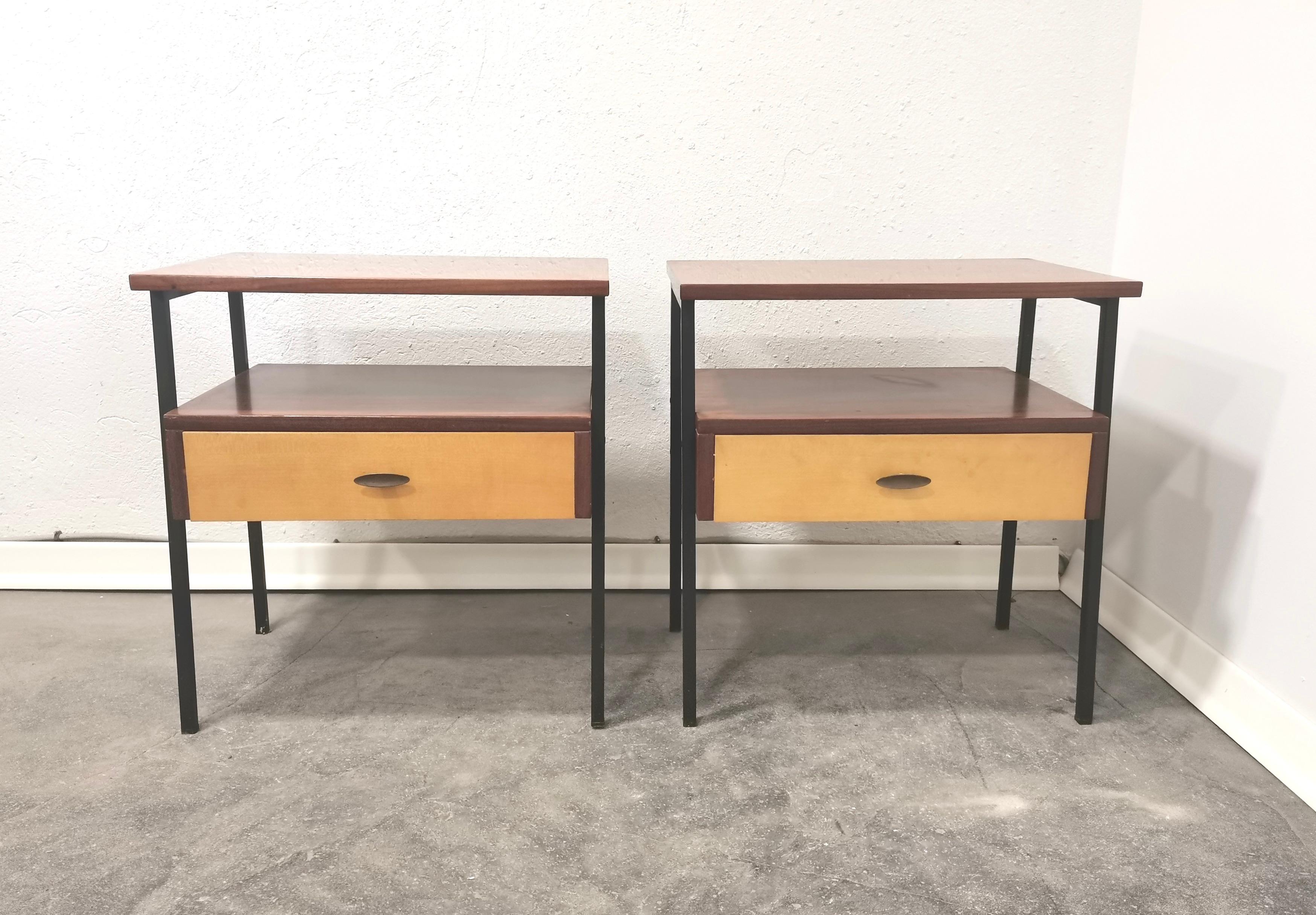 Pair of nightstands/bedside tables
This pair of italian bedside tables reflects modest but conteporary aesthetic. Practicality and perfect form in one pair of beautiful nightstands. 

Material: wood, plywood, furnished, metal

Period: 1970s

Style: