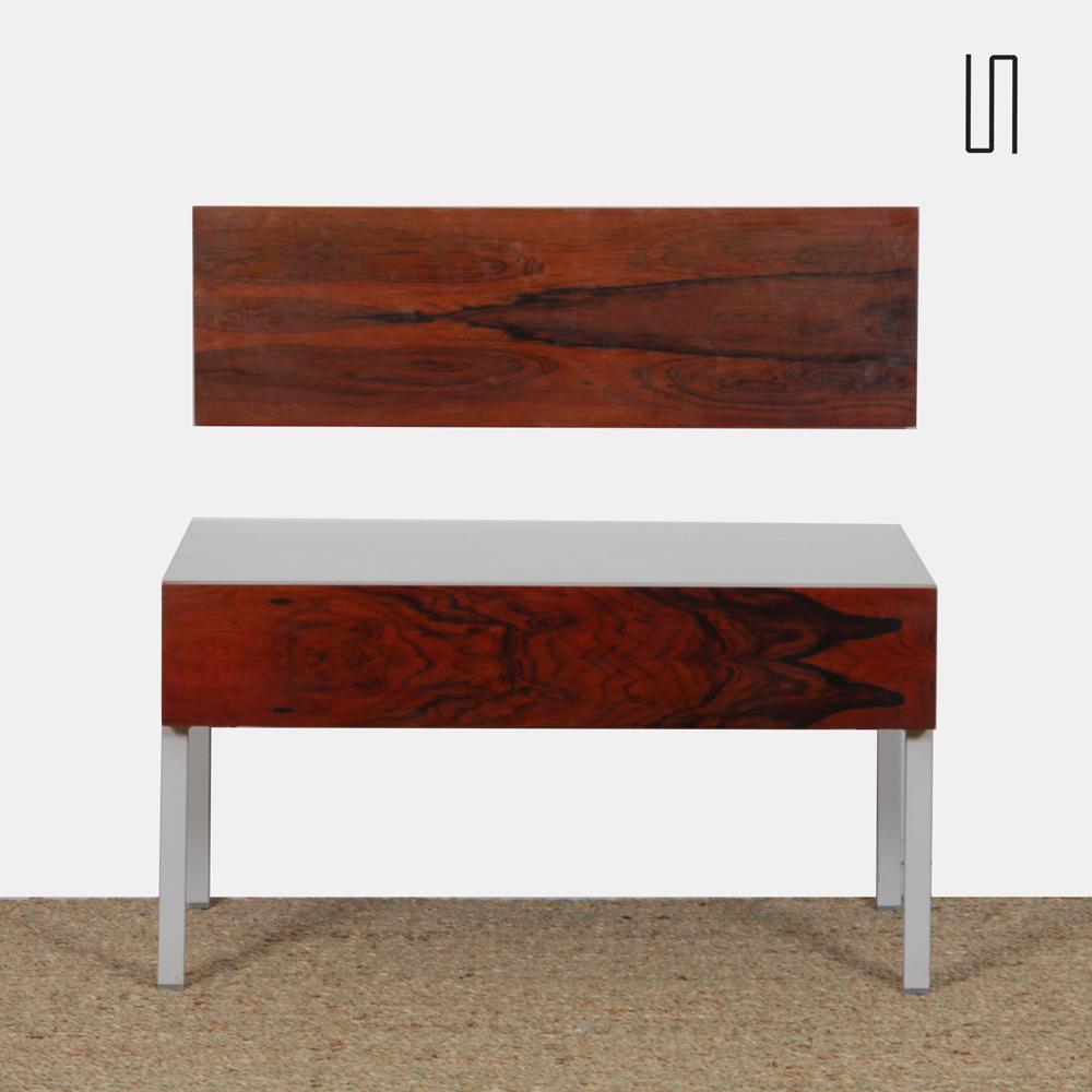 This bedside table was produced by Interlübke in the 1960s. The drawer and wall element are in rosewood. This bedside table is in good vintage condition.