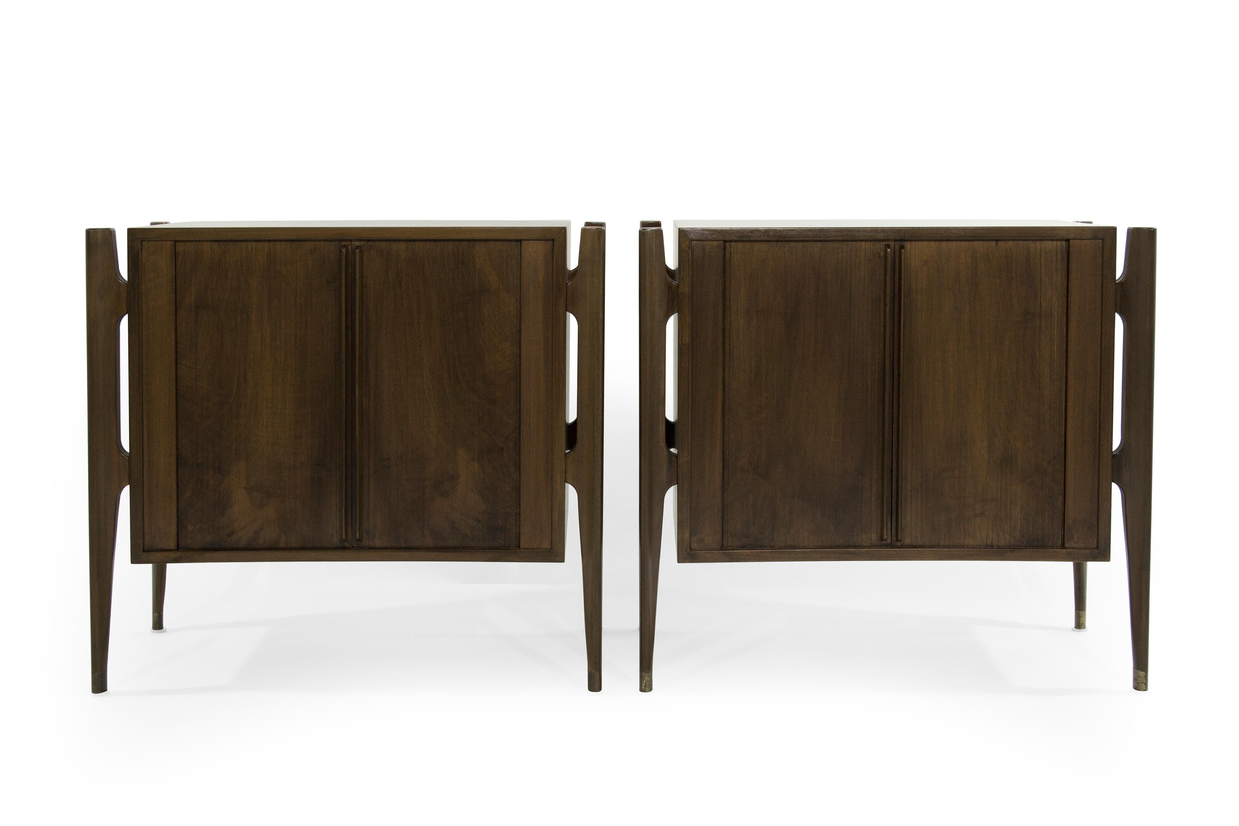 Extremely rare set of rosewood bedside tables designed by Jorgen Clausen for Brande Møbelfabrik in fully restored condition.

Often misattributed to Edmond Spence. This particular set features bookmatched tambour doors, exterior framing and brass