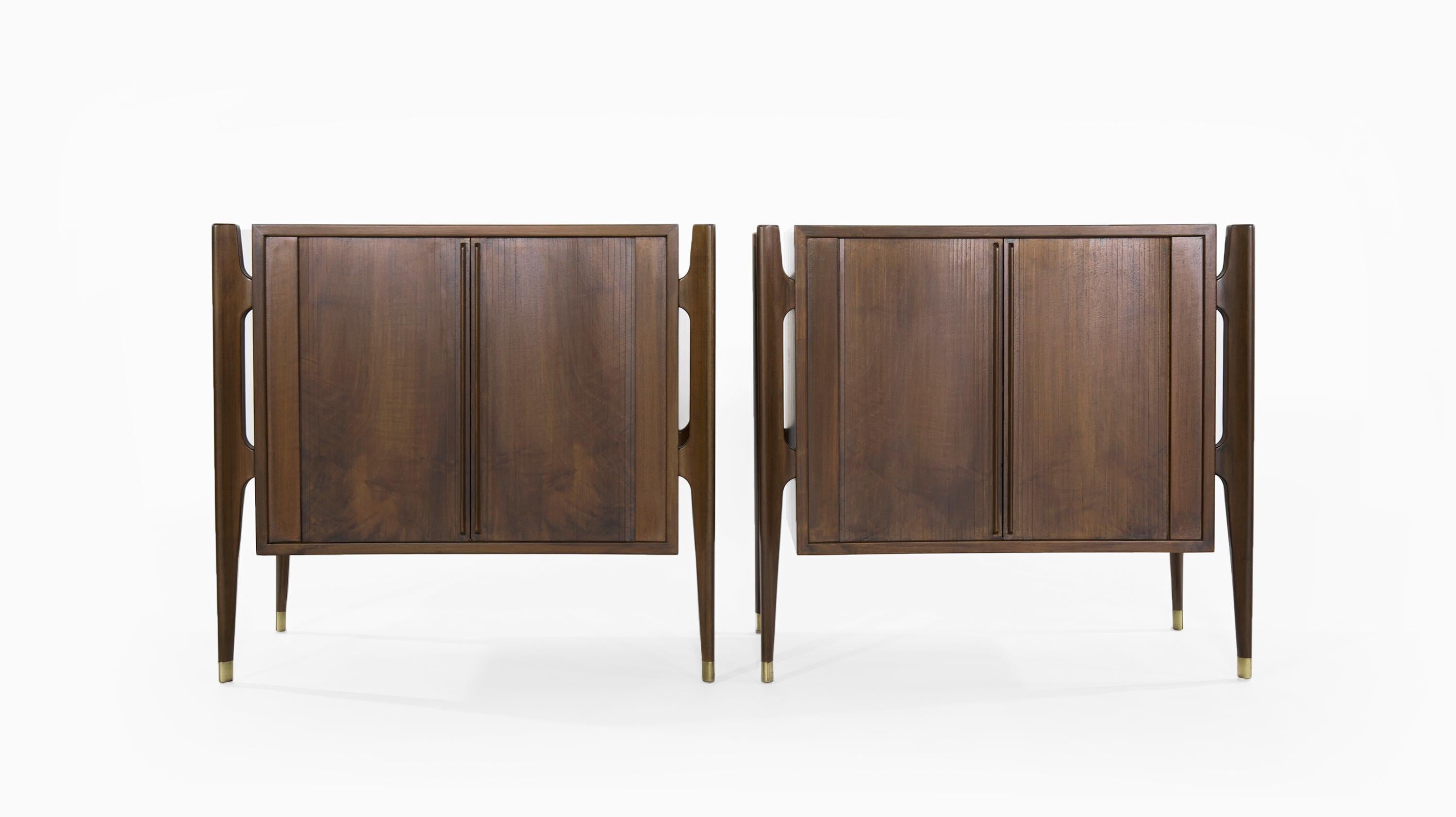 Extremely rare set of walnut bedside tables designed by Jorgen Clausen for Brande Møbelfabrik in fully restored condition.

Often misattributed to Edmond Spence. This particular set features bookmatched tambour doors, exterior framing and brass