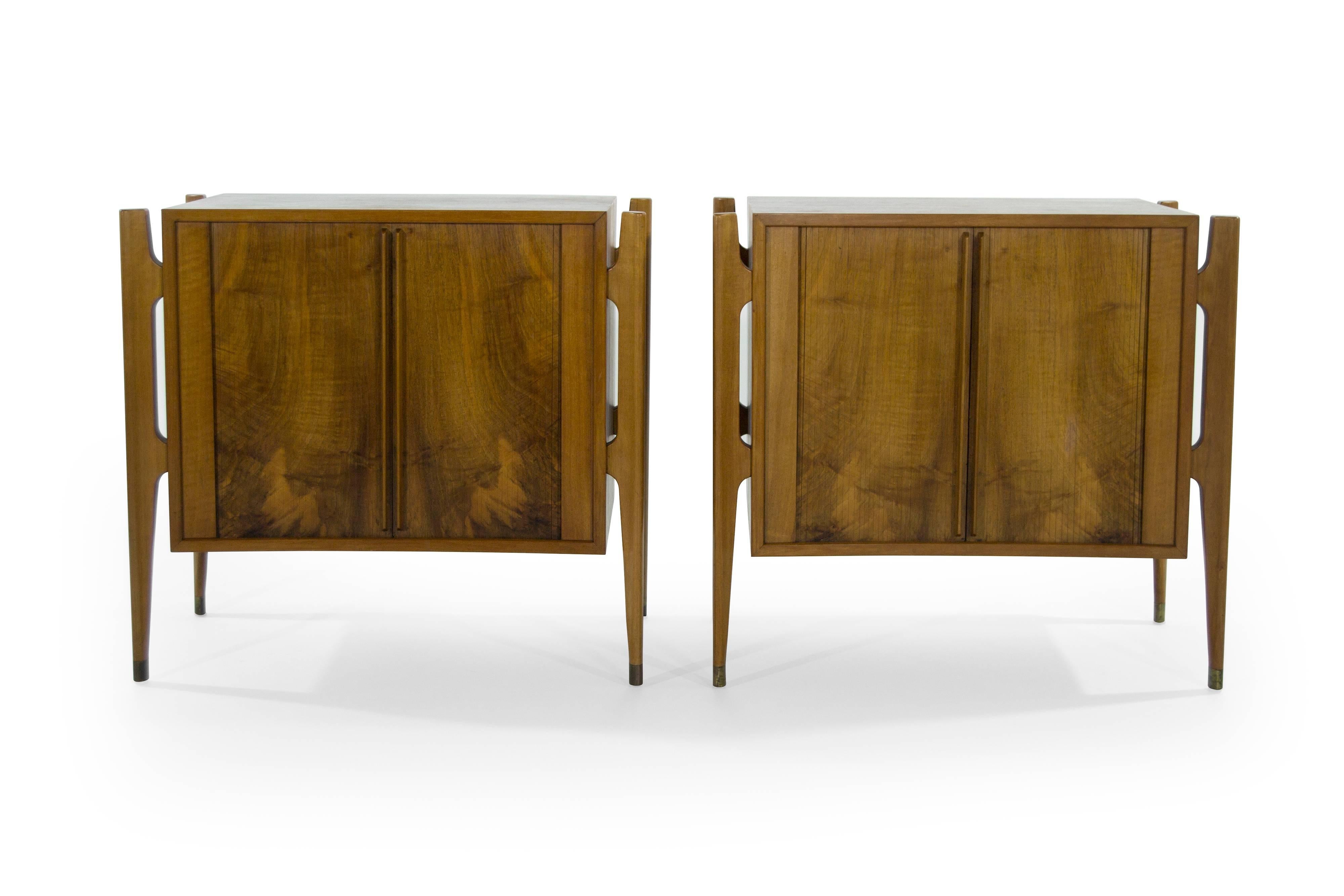 Extremely rare set of rosewood bedside tables designed by Jorgen Clausen for Brande Møbelfabrik in excellent vintage condition.

Often misattributed to Edmond Spence. This particular set features bookmatched tambour doors, exterior framing and brass