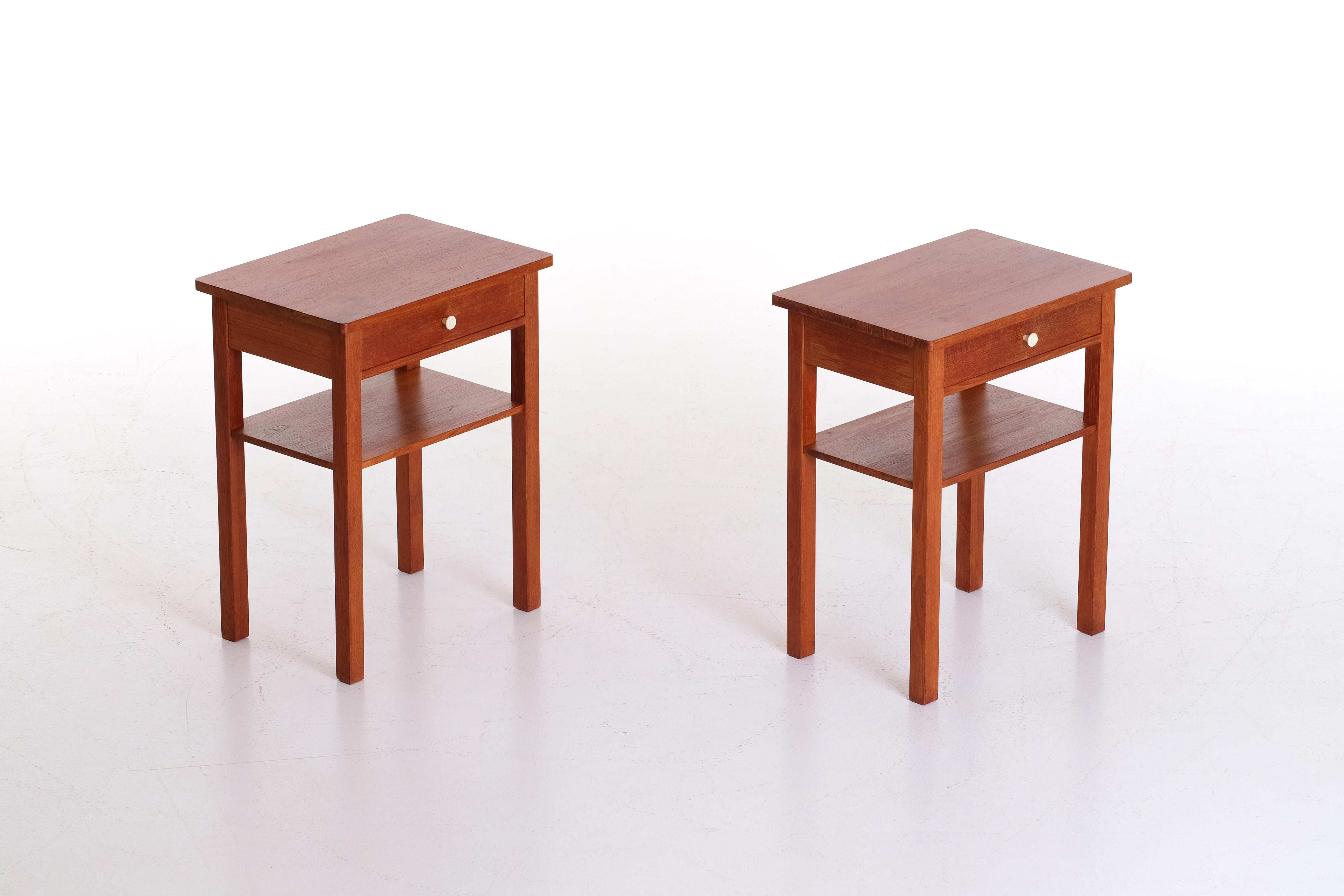 Pair of Swedish bedside tables from the 1960s.
Teak and white bakelite knob.