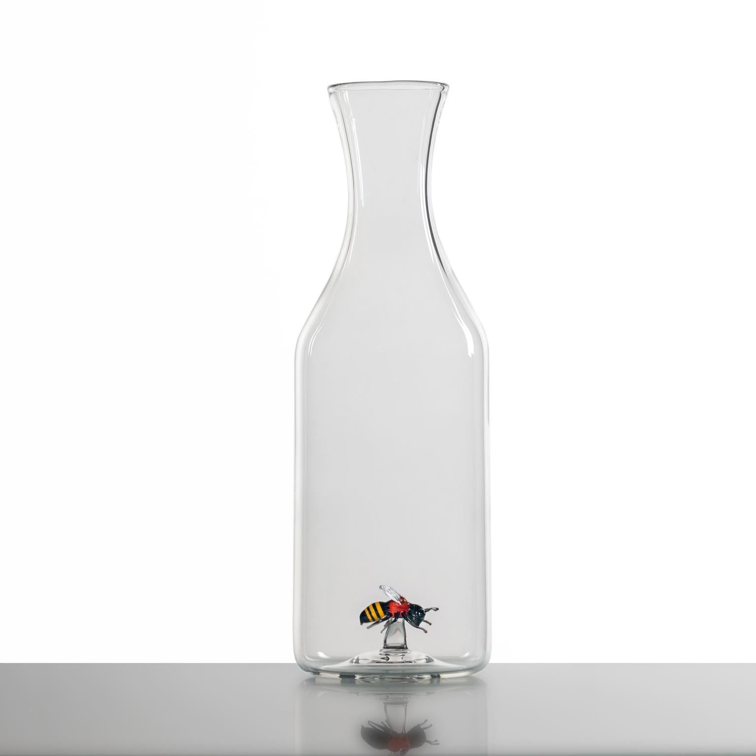 'Bee Bottle'
A Hand Blown Glass Bottle by Simone Crestani

A sleek glass bottle, elegant in its iconic transparency. Within it a small bee, portrayed in all its delicate essence, is the true protagonist of this work. The only note of color,