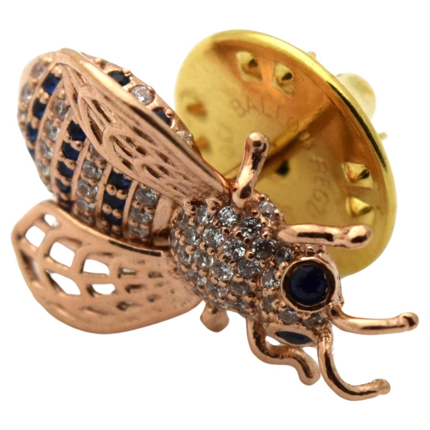 Stunning brooch so perfect for the suit, the brooch is made with diamonds and sapphires totaling 1 carat in 14KT rose gold. The closure of the brooch is made with stainless steel metal.

 It will come with a beautiful packaging and certificate of