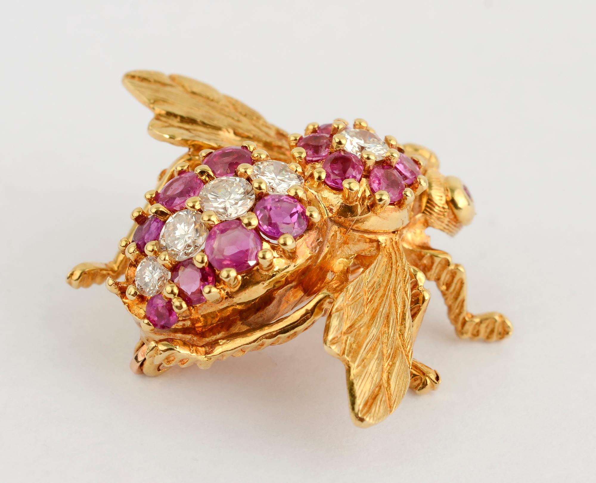 Elegant bee brooch with rubies and diamonds. The five diamonds are graduated in size with the largest measuring 1/4 carat. The eyes are rubies.
The 18 karat brooch is signed HR but I am not familiar with the maker.