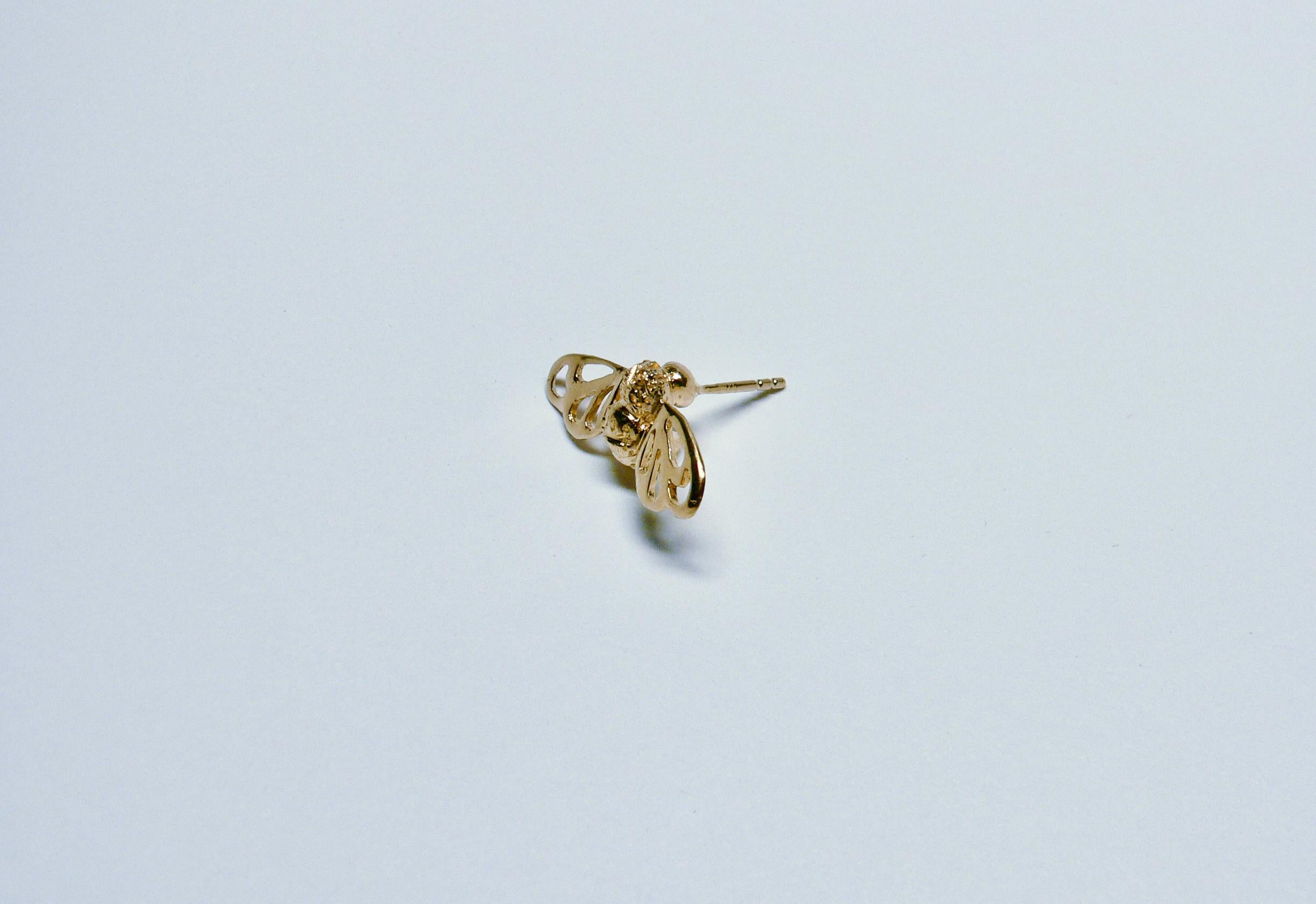 Bee earring from Bee Collection is made of Sterling Silver with 18 Karat gold plated. It is a motif of honey bee resting on the flower or on the leaf.

The size is about 11mm length, 22mm width, 17mm depth (included post length) and 3grams of this