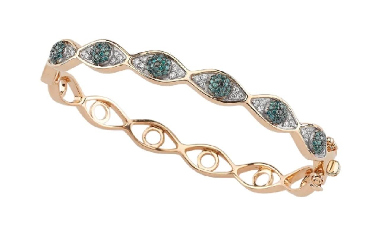 Bee Goddess Eye Light 14k Gold Blue/ White Diamond Bangle 
Crafted from 14k Gold and adorned with a 0.33 Ct H Vs-si Diamond and a 0.56 Blue Diamond, this talisman epitomizes elegance and sophistication while serving as a tangible beacon of divine