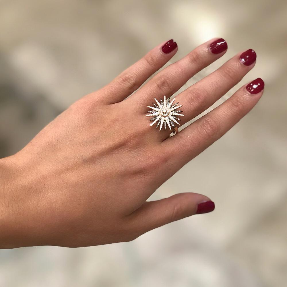 The Jardin Star Ring is a show stopper - Perfect for illuminating special occasions and enhancing any daytime look, its inspiration is the eleven pointed star; the Spiritual Messenger.  

Set in 1.29 carat pavé brown and 1.65 carat white diamonds to