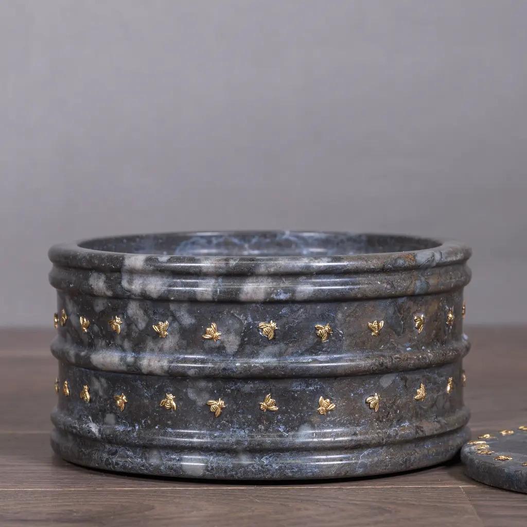 Bee Motif Candy Dish – Grey and Black Marble, 18th Century

Elegant candy dish in grey and black marble, finely decorated with golden bee motifs. Each piece, hand-carved and patinated, combines authenticity, refinement, and the charm of 18th-century