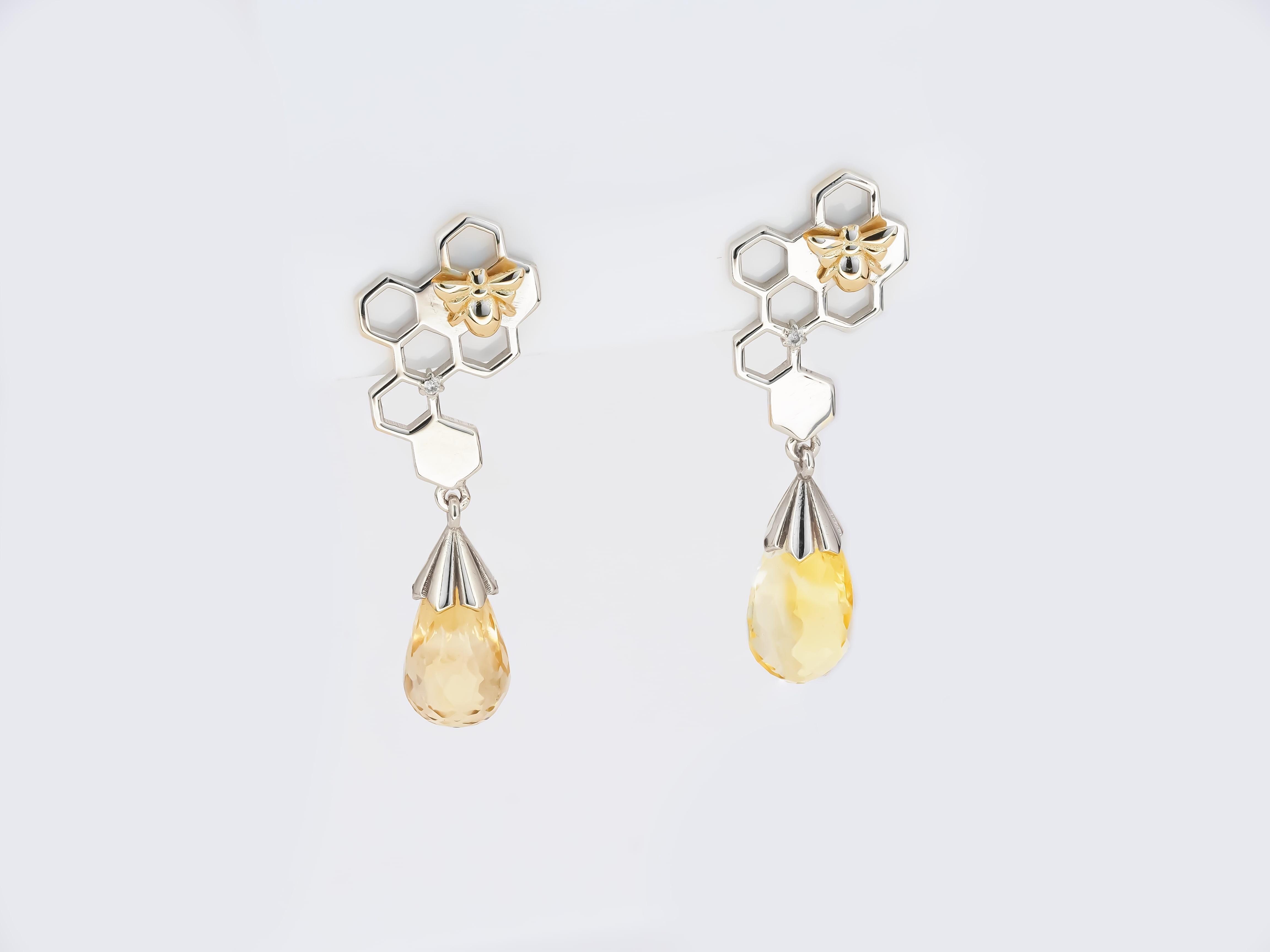 Bee on honeycomb 14 kt solid gold earrings studs with natural citrines briolettes. November birthstone earrings studs. Contemporary design earrings.
Gold: white and yellow (bee) 14kt solid gold.
Earrings size: 33 x 11.3 mm.
Total Weight:  3 g. can