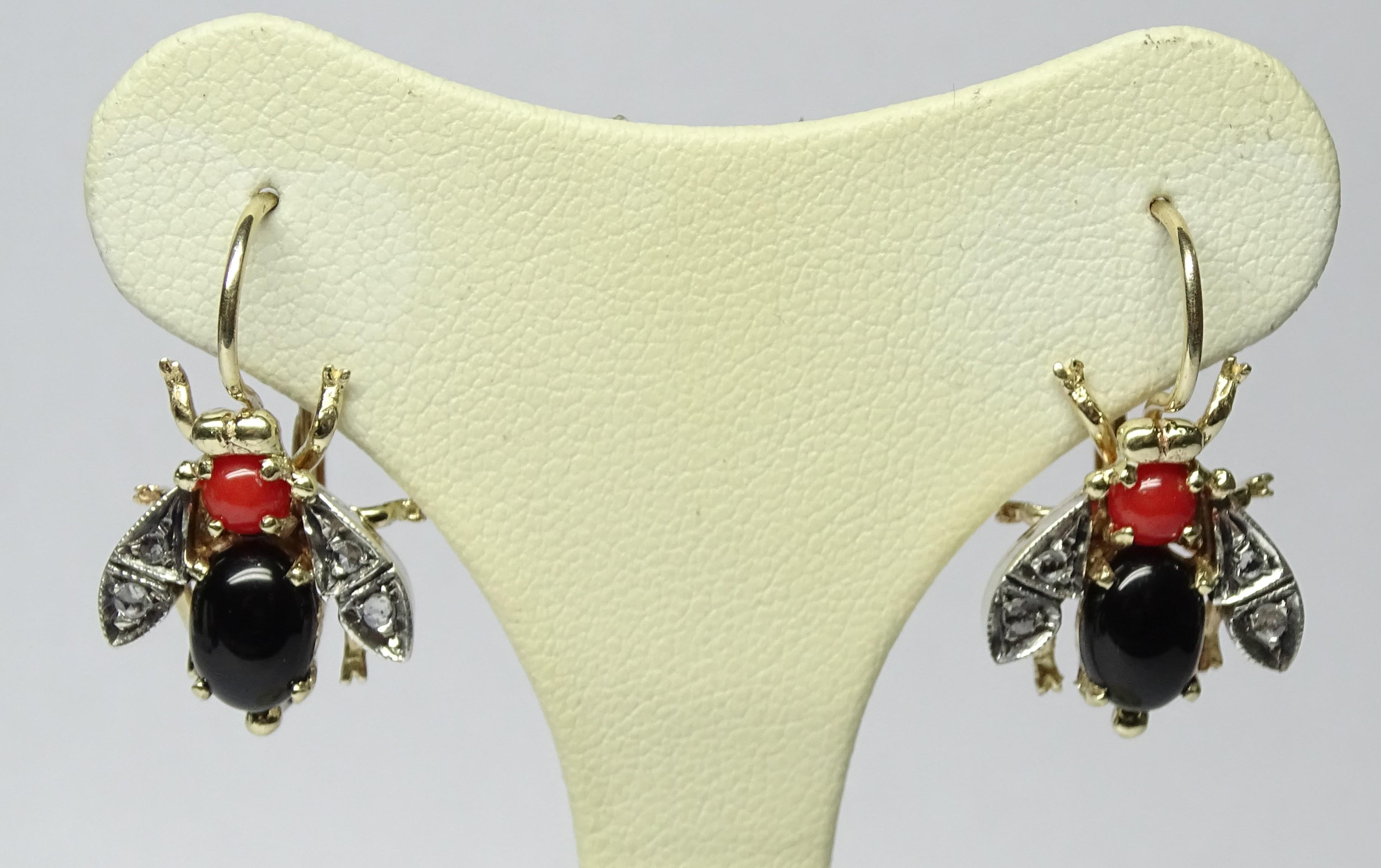 These Earrings are made of 9K Yellow Gold and Sterling Silver.
These Earrings have 0.16 Carats of Rose Cut Diamonds.
These Earrings have Onyx and Coral.
These Earrings are inspired by Art Nouveau
All our Earrings have pins for pierced ears but we