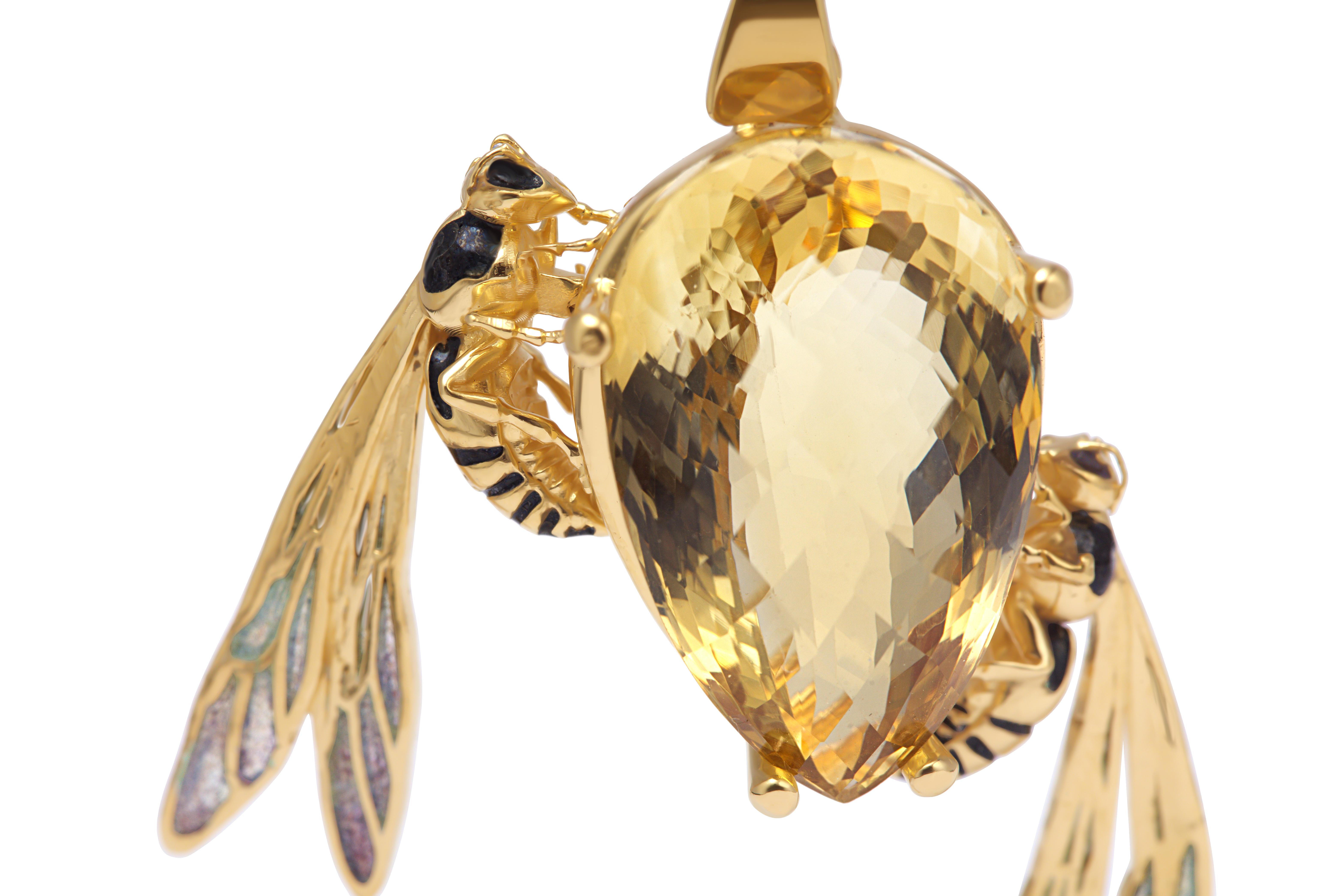 This sculptural bee pendant is meticulously handcrafted in sterling silver and plated with a thick layer of 24k gold vermeil. The wings are adorned with plique-à-jour enamel, a rare and demanding technique that suspends transparent enamel between
