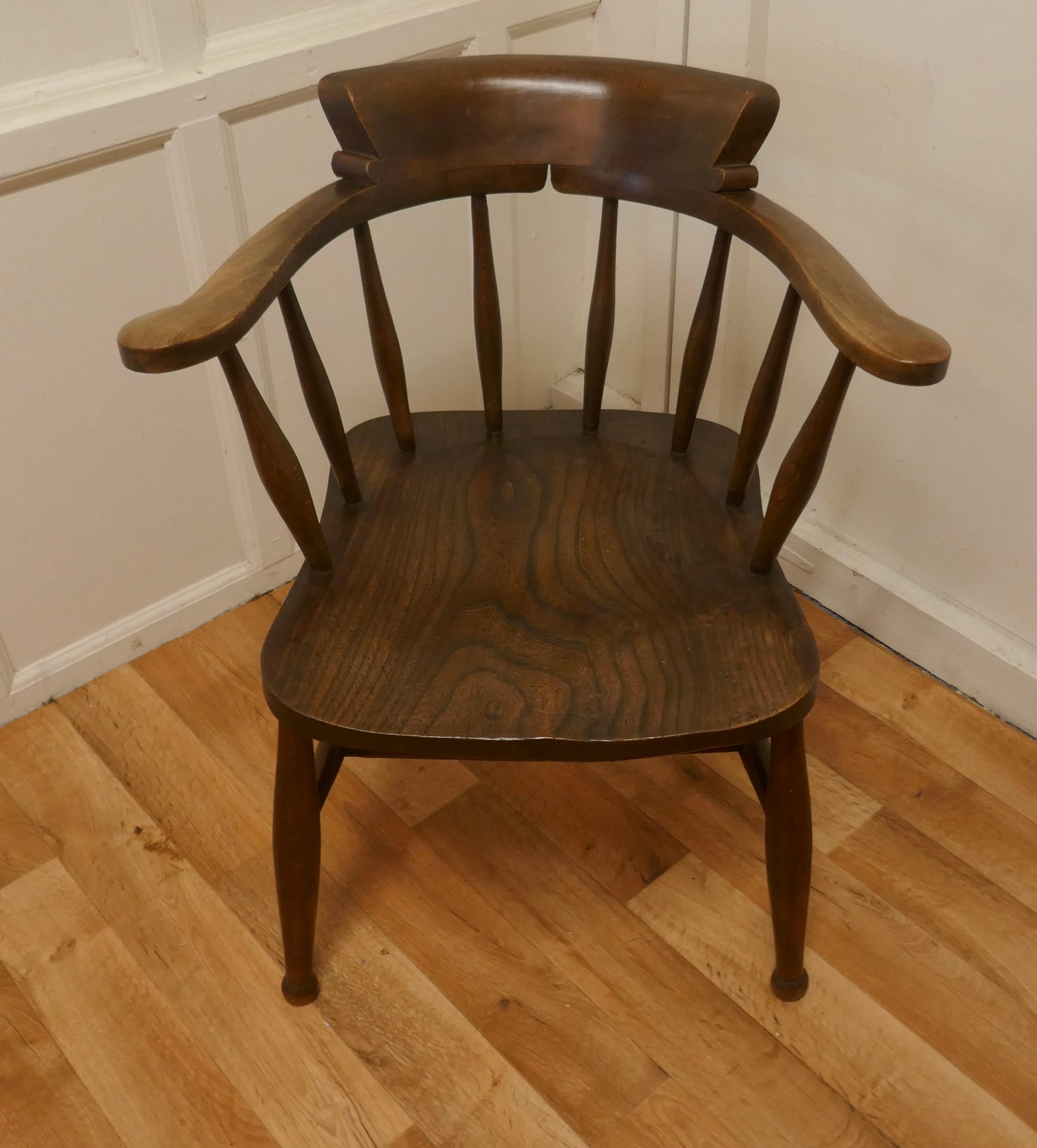 Beech and Elm smokers bow office or desk chair

The chair has a solid Elm saddle carved seat and an attractive curving back with a wide curved top rail and double stretchers underneath 
The chair stands on sturdy turned legs and is in good sound