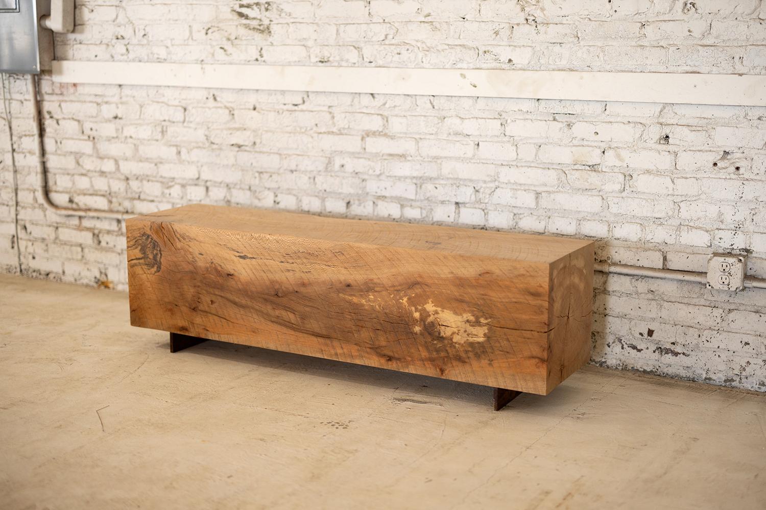 Experience the rustic charm of our Hardwood Beam Bench, crafted from a variety of native wood species and featuring a backless and narrow design. The simple lines highlight the unique texture of the end grain, while the Corten steel base adds