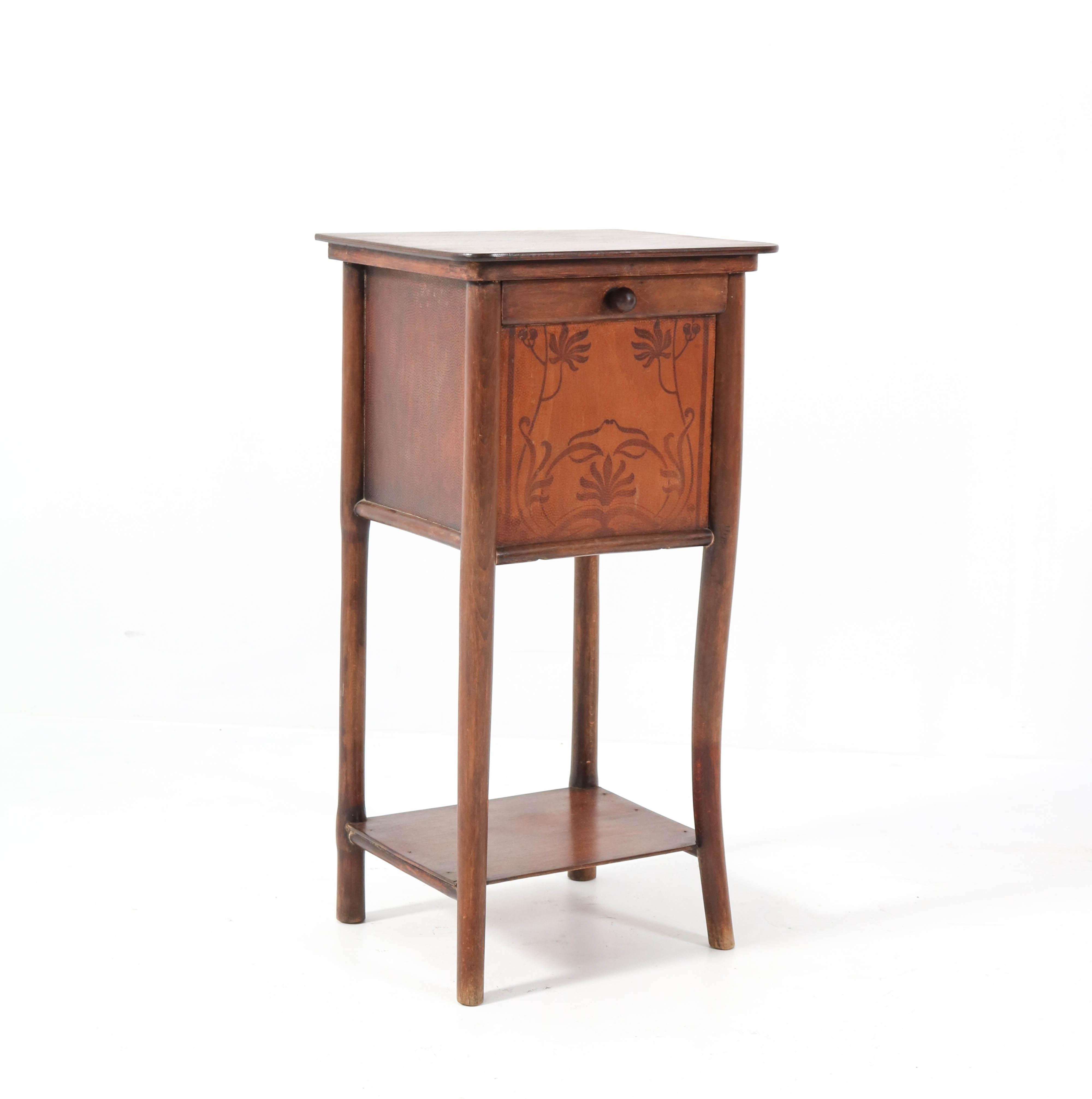 Stunning Art Nouveau nightstand.
Design by Jacob & Josef Kohn Vienna.
Beech bentwood frame.
Marked with original manufacturers label.
In good condition with minor wear consistent with age and use,
preserving a beautiful patina.
    