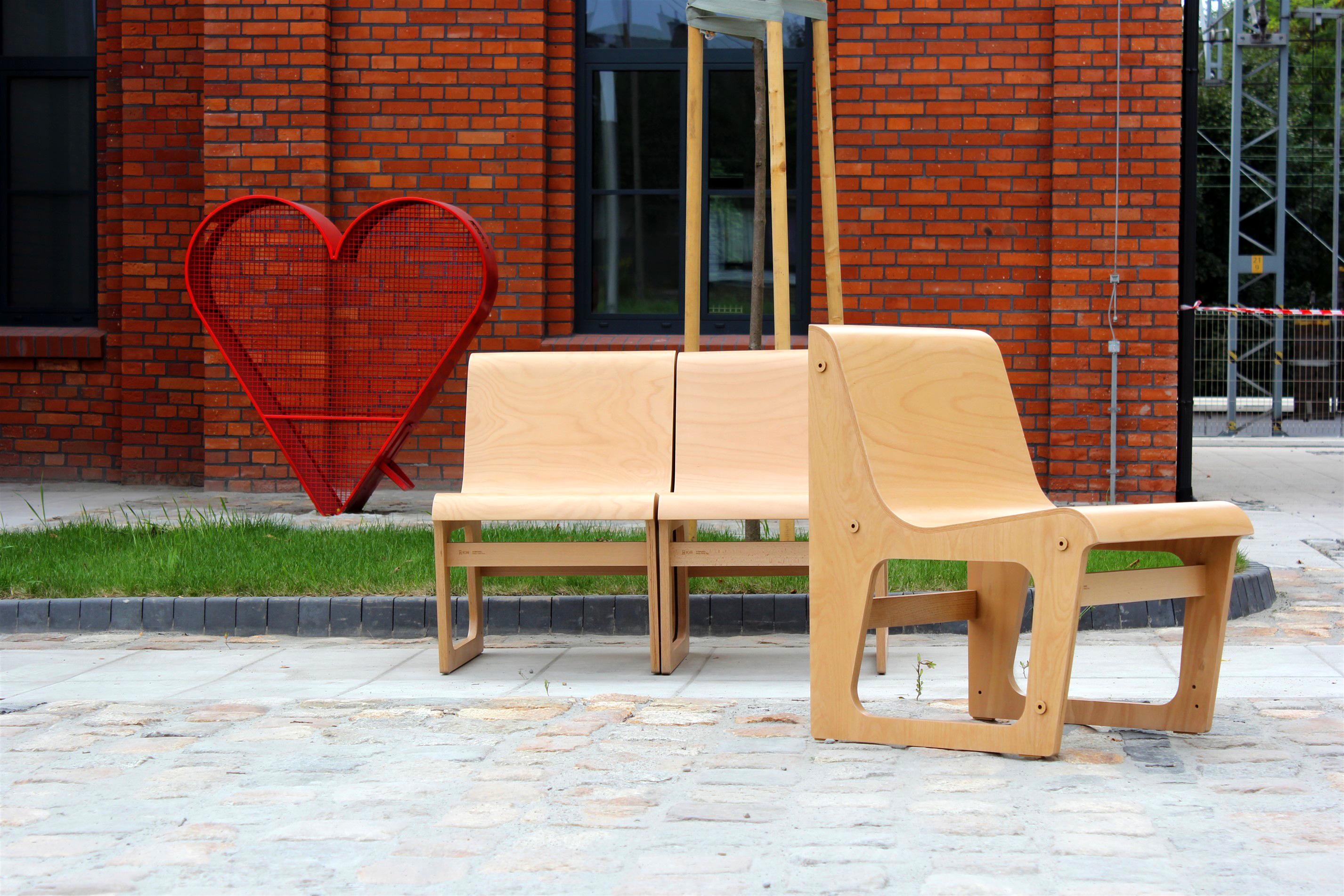 This Symposio bench made of bent beech plywood was designed by René Šulc for TON and produced around 2011. 
The bench was presented at Milan Design Week, it consists of three chairs that can also be placed separately. 
It was produced for a short