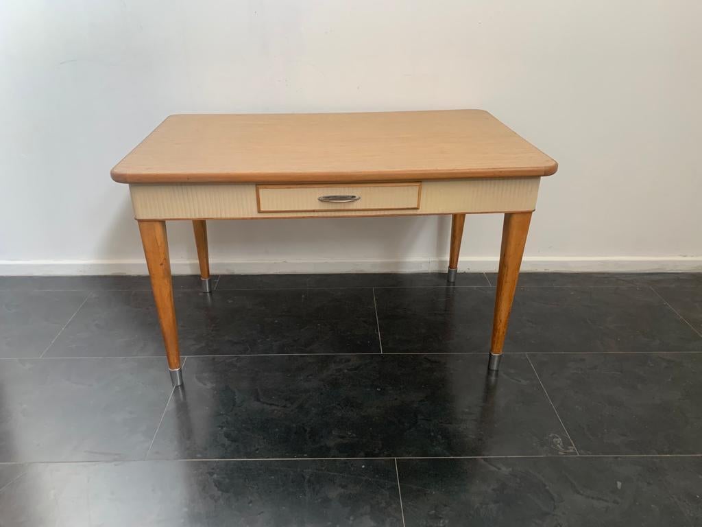Kitchen table in beech shaped top with a thousand lines laminate inserted, underneath grissin and matt ivory lacquered top, brass tips, present drawer and top for general work, extensions not available.