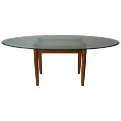 Table de salle à manger avec base en bois de hêtre et plateau en verre ovale
