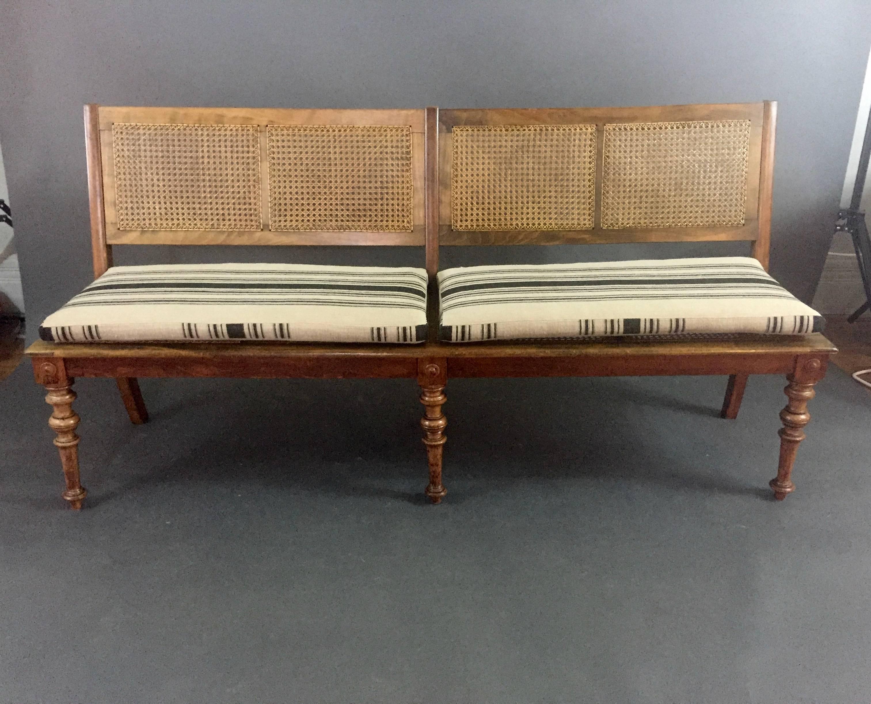Purchased in Sweden, though likely of Continental production in the Art Nouveau period. This bench has a beechwood frame with carved leg detail and French caning to four sections of seat bottom and back Exceptionally long at 70.