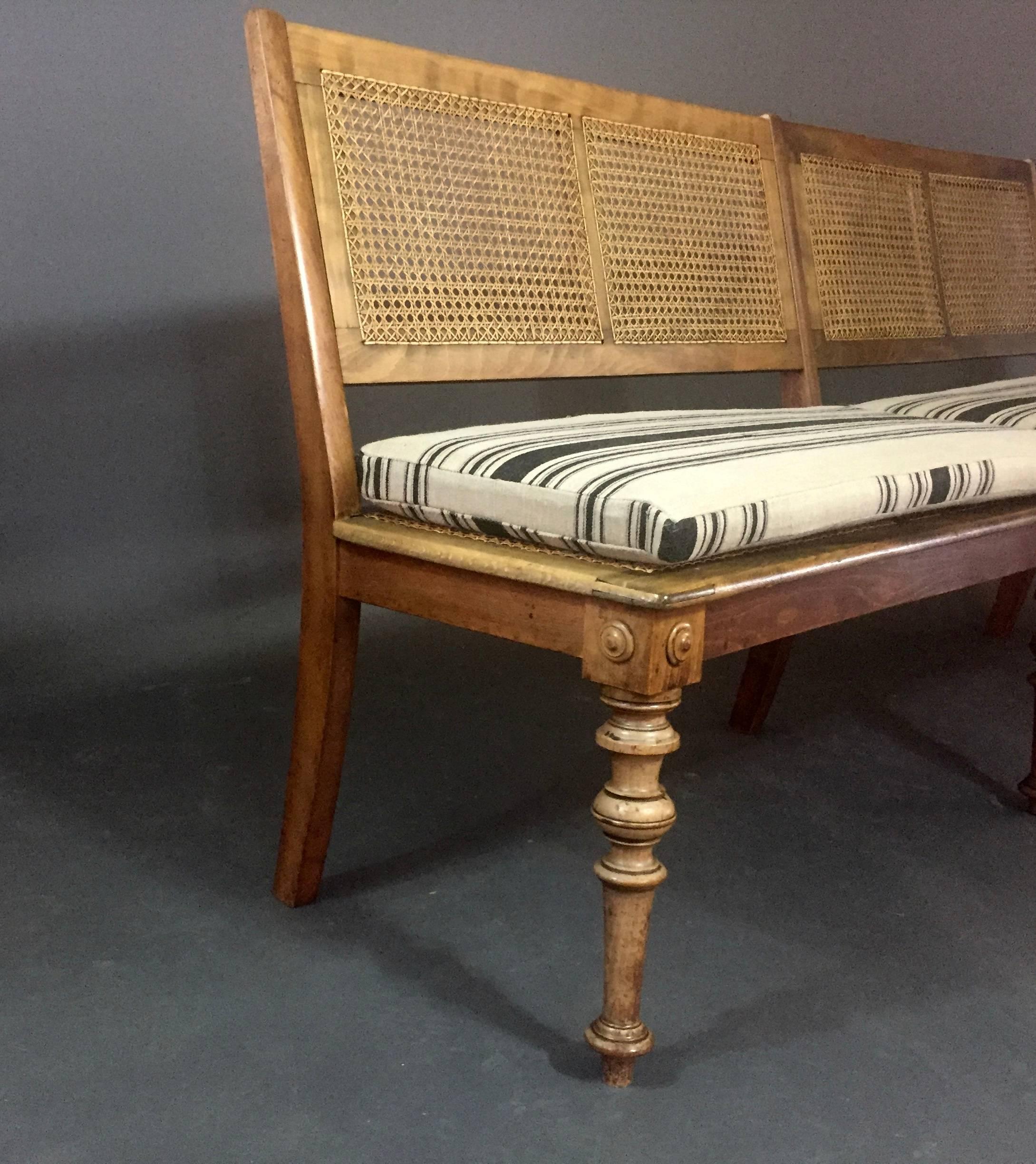 Early 20th Century Beechwood Long Bench with French Caning, Linen Covers, circa 1915 For Sale