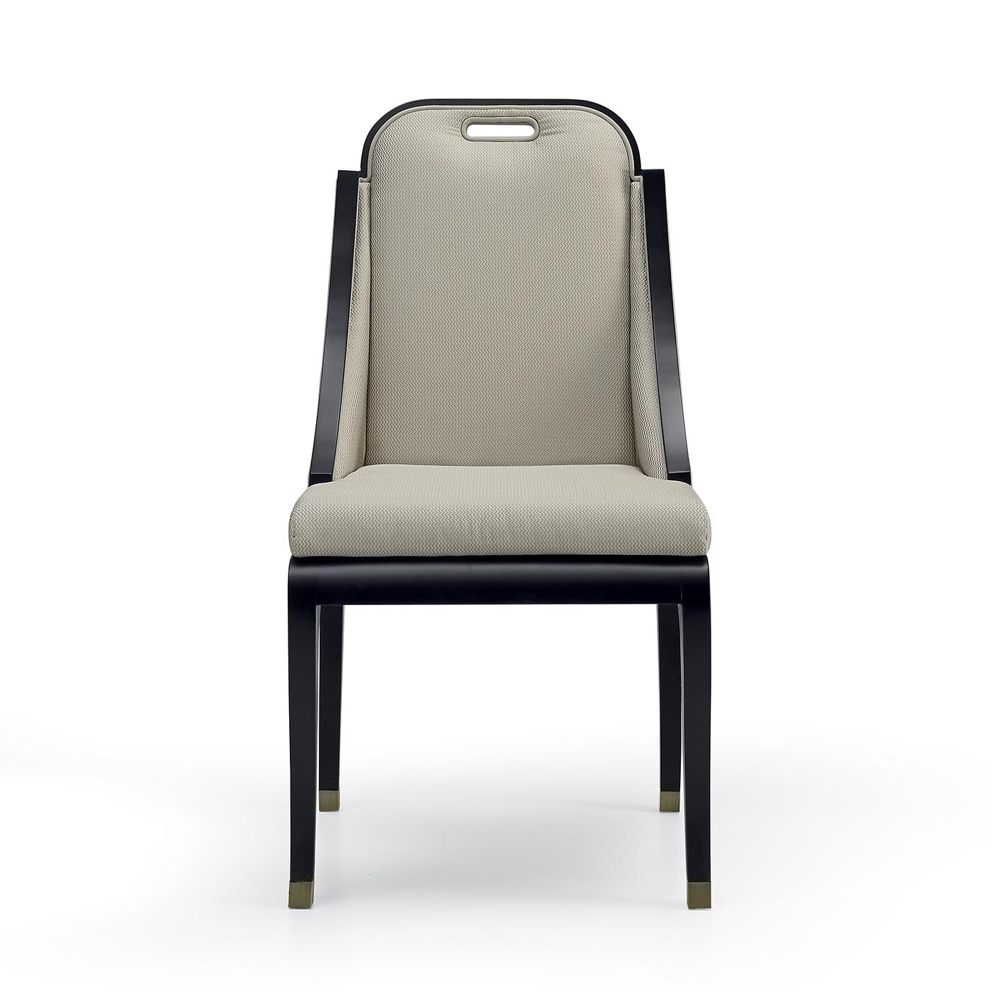 A simple design of refined sophistication distinguishes this stunning chair boasting a black lacquered beechwood frame that comprises sinuous legs enriched with metal ferrules. The seat and backrest are padded with soft polyurethane foam for an