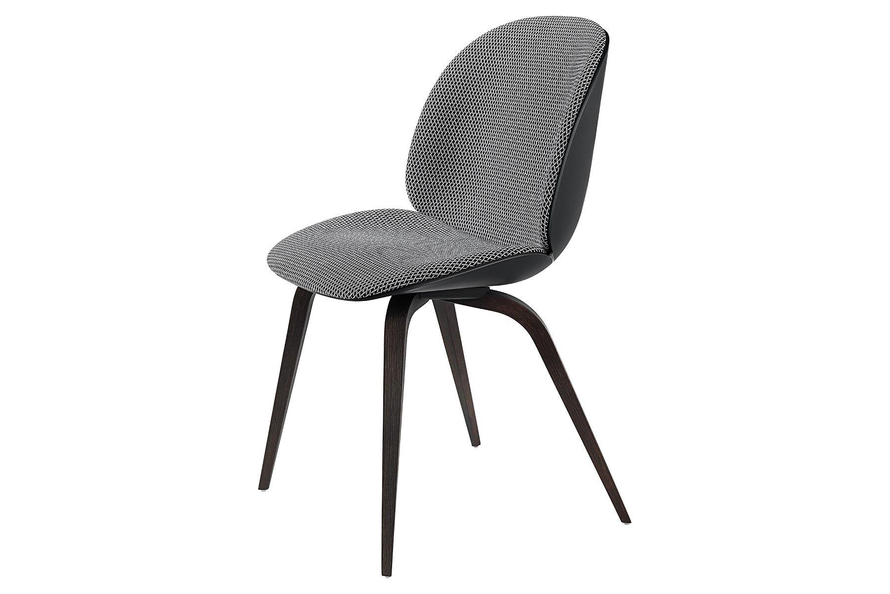 Looking closely at the anatomy of the beetle insect, characterized by its solid outside and soft inside, the front upholstered Beetle chair possesses all attributes. The front upholstered Beetle chair holds the same soft core as the fully