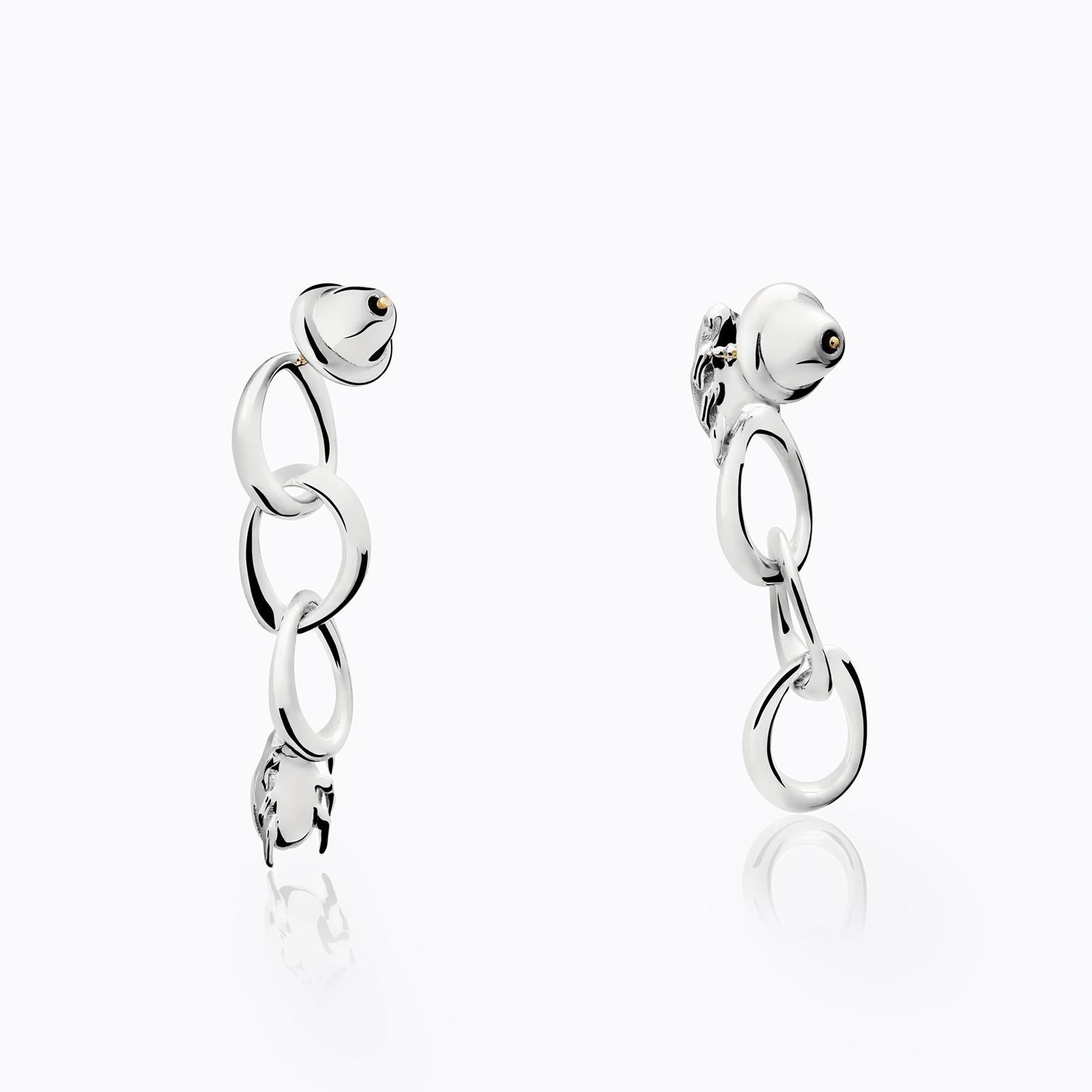 The Beetle Earrings from the Animal´s Collection by TANE are made in silver .925. They are composed of a series of links inspired by nature, designed especially for the collection. Each earring features a Beetle, sculpted in every detail of its