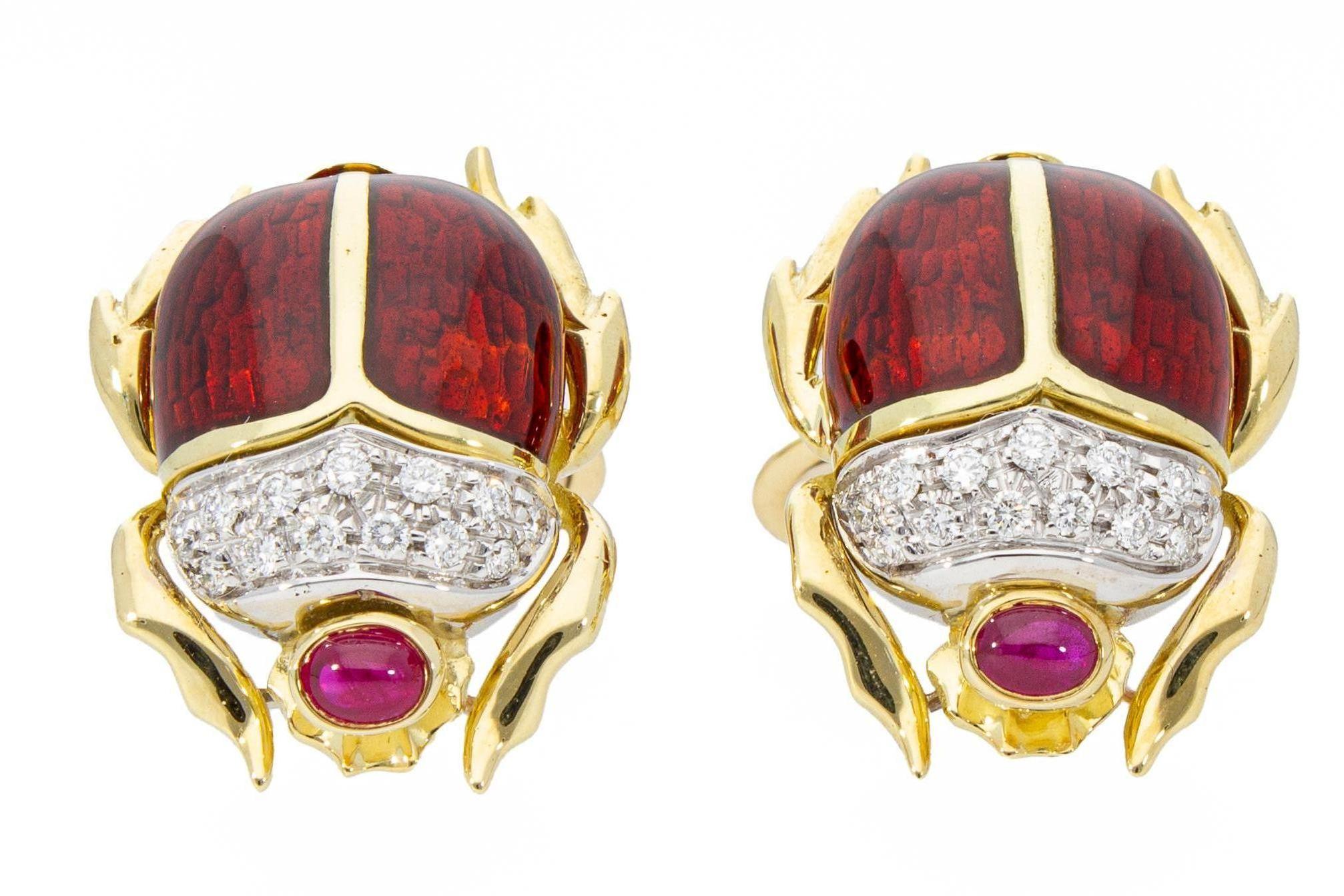 The cufflinks are in the shape of a beetle, they are in 18 Kt yellow gold and red enamel with firework. 
The cufflinks have a pavé of diamonds with a total carat weight of 0.26 ct and 2 oval cabochon-cut rubies with a total carat weight of 0.50 ct.