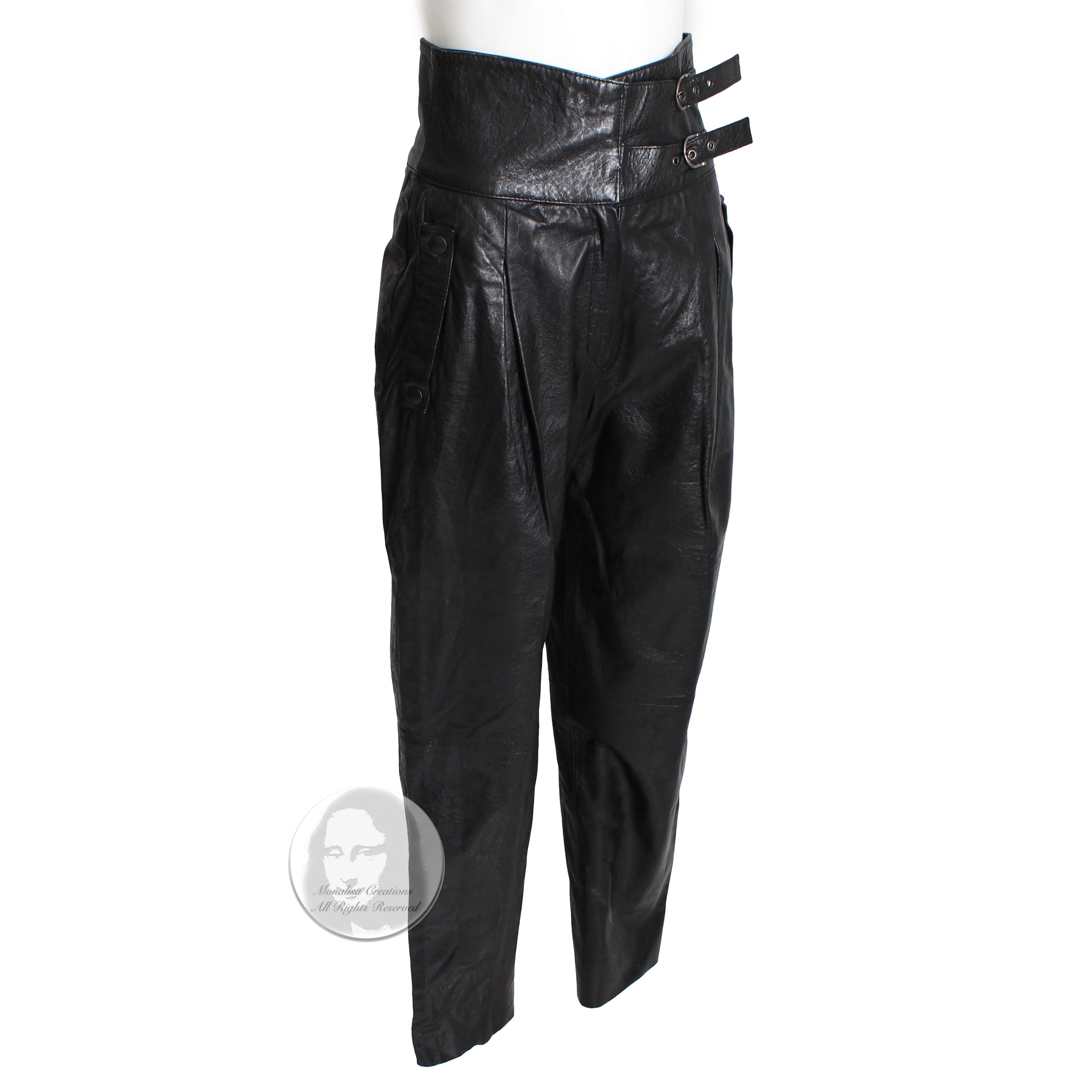 Vintage Beged-Or black leather pants, made in Israel, most likely in the 1980s. Made from stamped black leather, these chic leather pants fasten with a zipper, hidden flat hook & eye fasteners and two buckles, and feature slick snap pockets at each