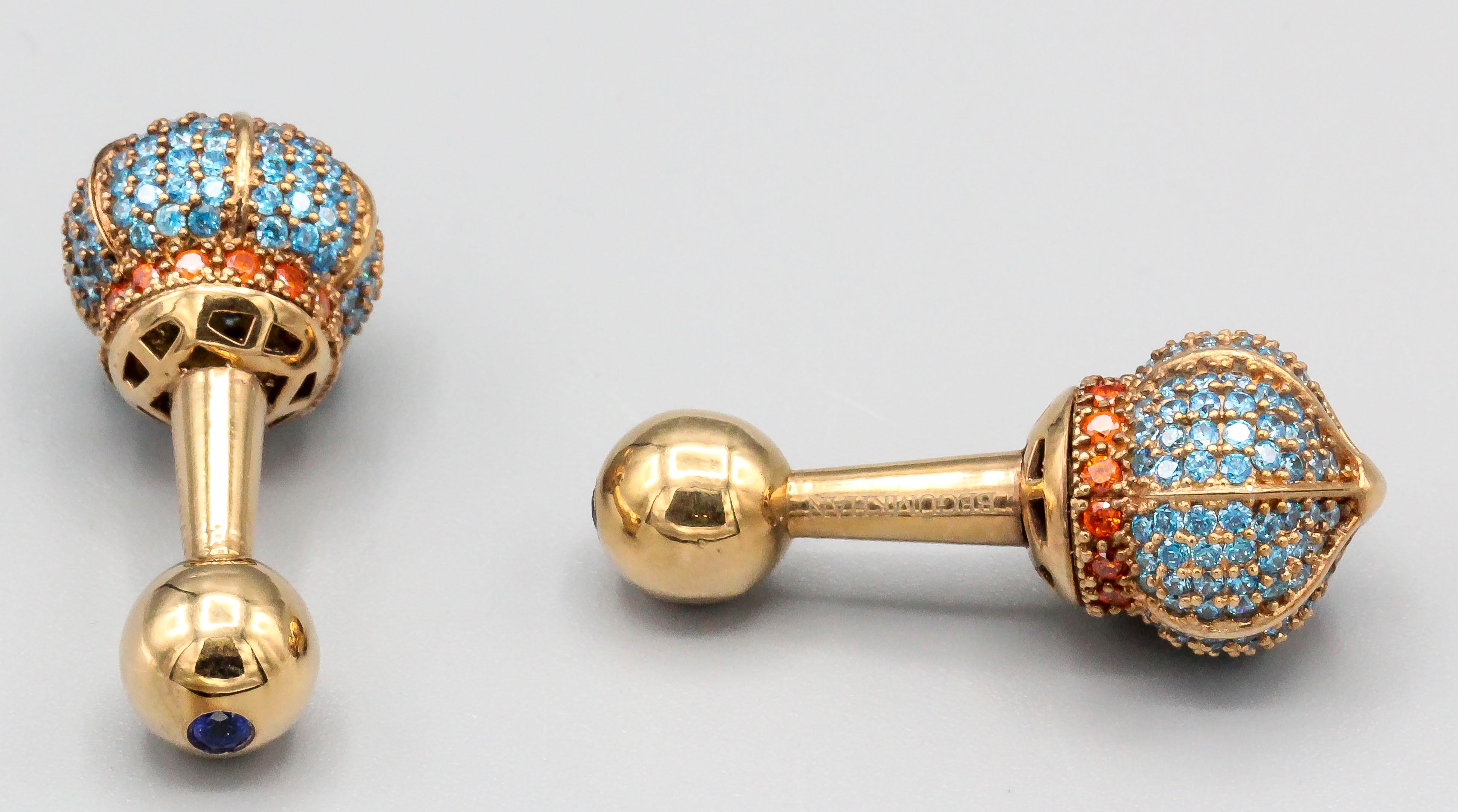 Very fine pair of 18k gold and multi-colored stone dumbbell cufflinks by Begum Khan. The cufflinks feature a scepter like design pave set with colored stones, which appear to be tourmalines and garnets but have not been tested, with the opposite end