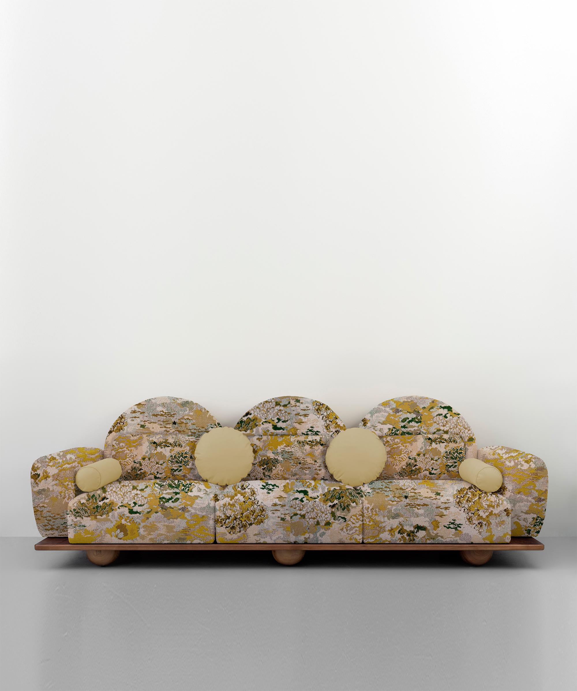 Beice is a 3-seat sofa designed to mimic the feeling of sitting on cotton candy clouds. The combination of its yellow patterned fabric, arc shaped back rests, round edges and sphere walnut feet creates a dreamy, tender design. It is wide enough to