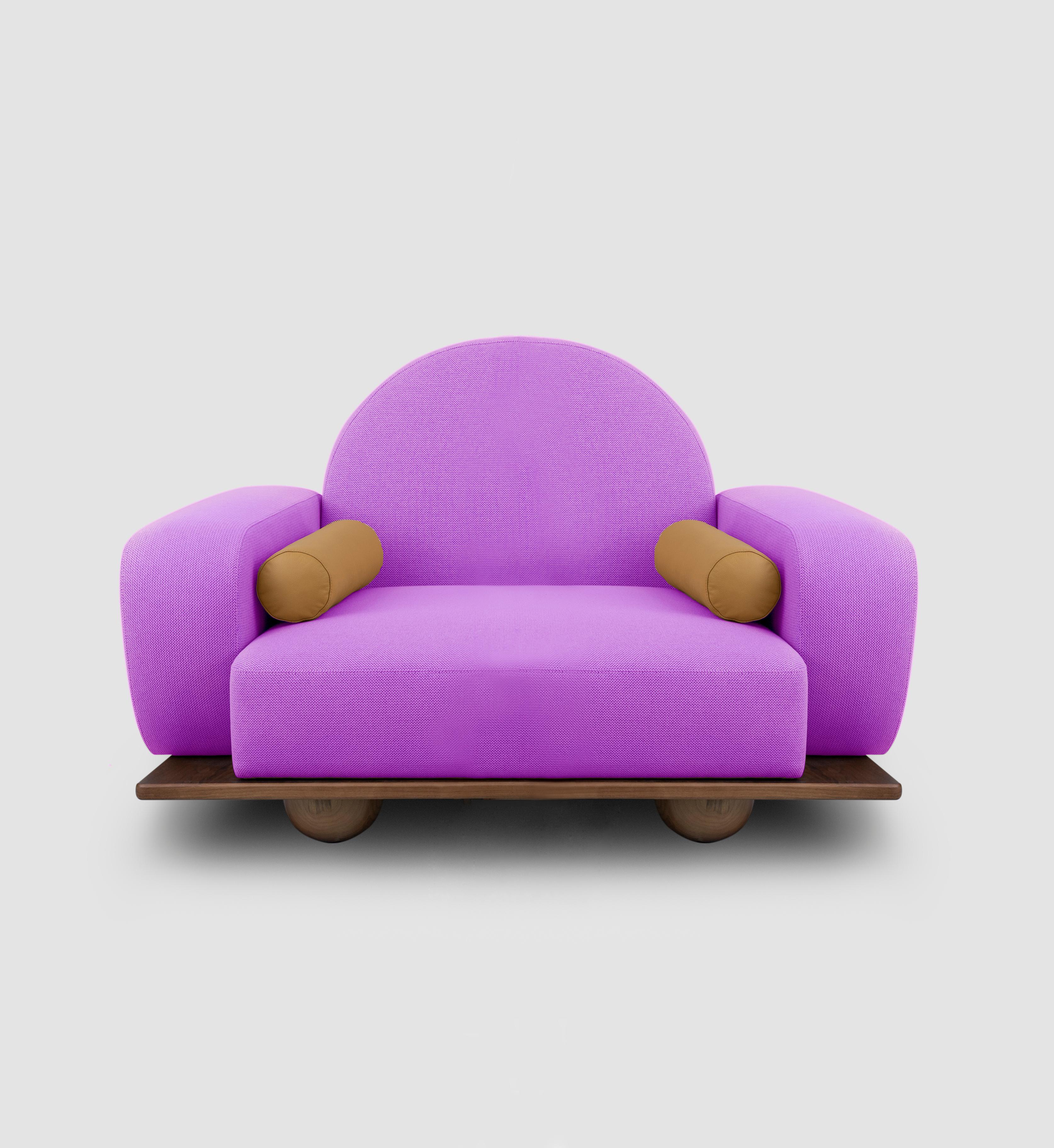 Beice armchair is designed to mimic the feeling of sitting on a cotton candy cloud. The combination of its color, arc shaped backrest, round edges and sphere walnut feet creates a dreamy, tender design. Beice is entirely handcrafted and customizable.