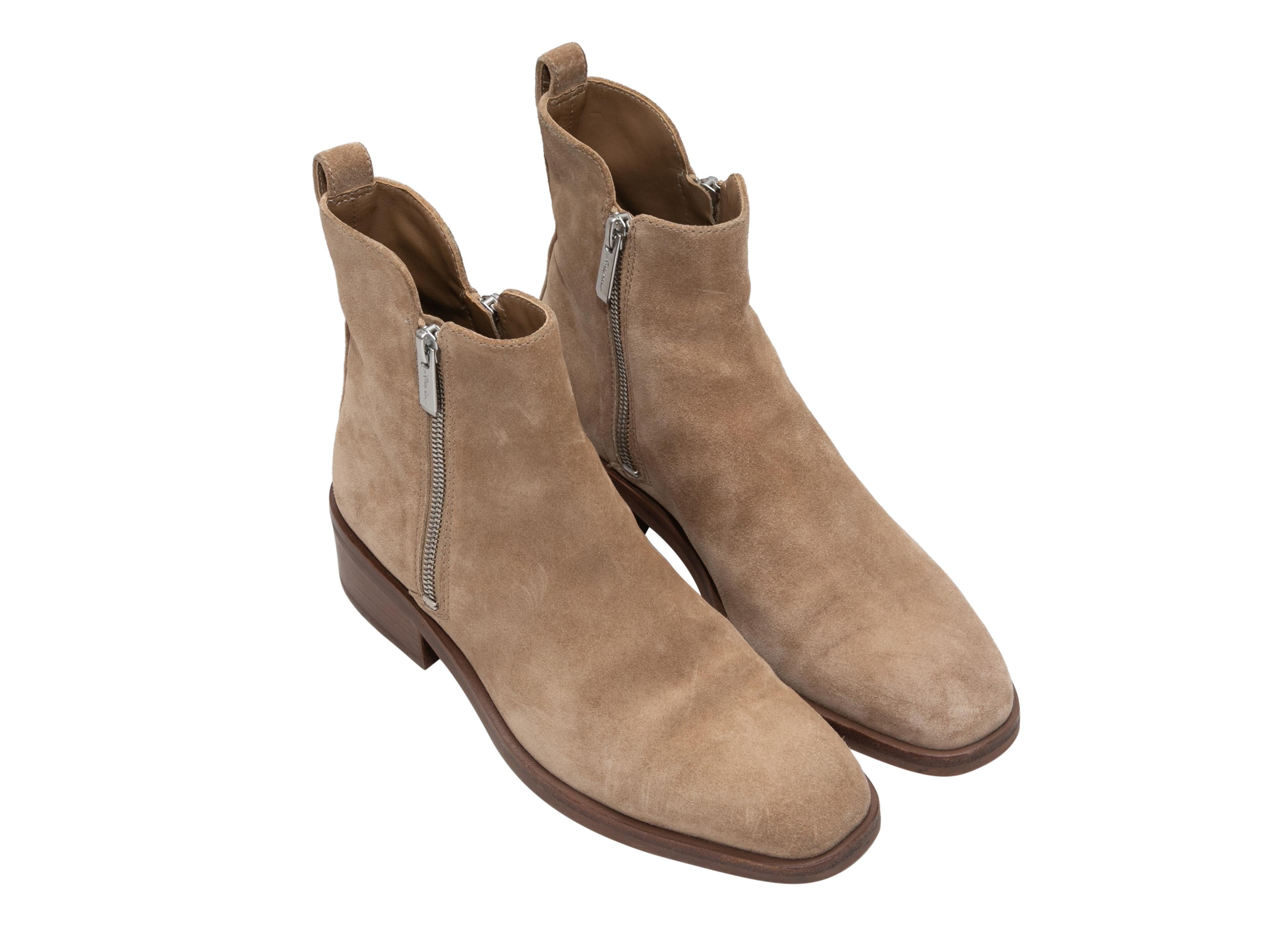 Beige suede flat ankle boots by 3.1 Phillip Lim. Stacked heels. Zip closures at sides. 5.5