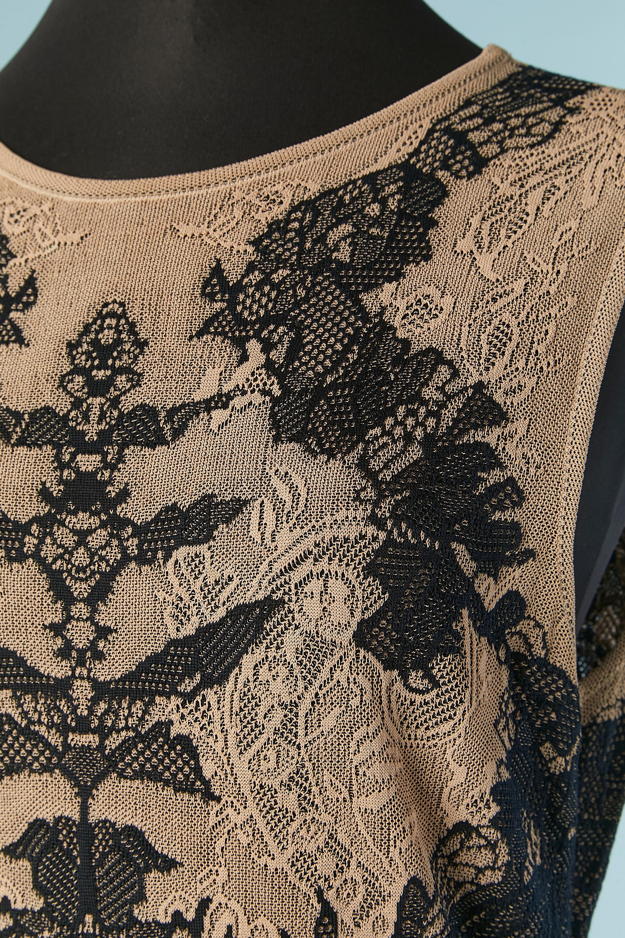 Beige and black jacquard lace knit cocktail dress without sleeves. No fabric composition tag but probably rayon. 
SIZE 40 (Fr) L 