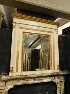 Beige and gilded lacquered wooden mirror with carved side columns, France