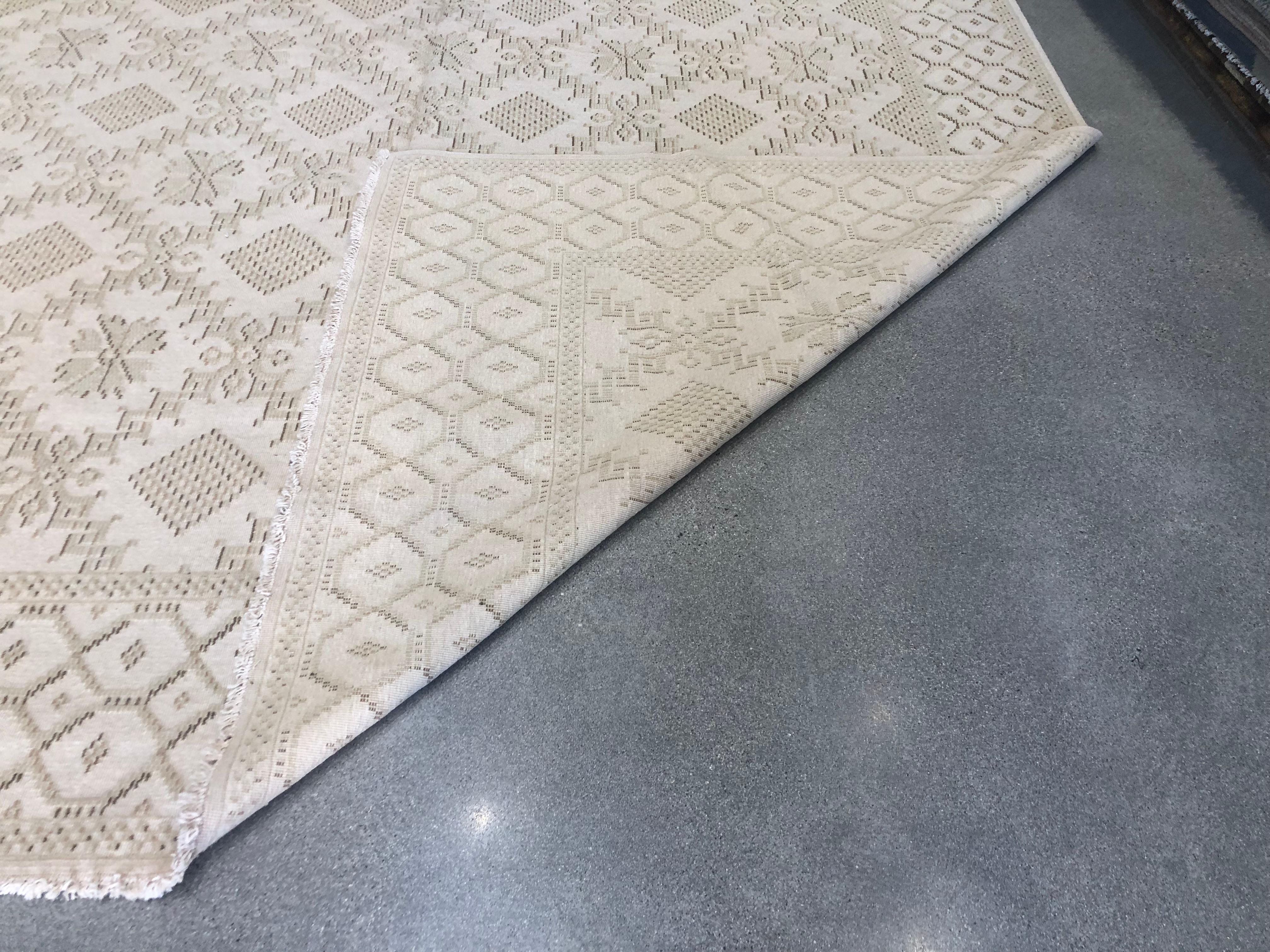 Beige is definitely not boring in this intricate design that brings to mind a curtain of handmade lace. The neutral beige and tan tones will bring warmth and light to any space. Hand knotted wool. Made in Europe.