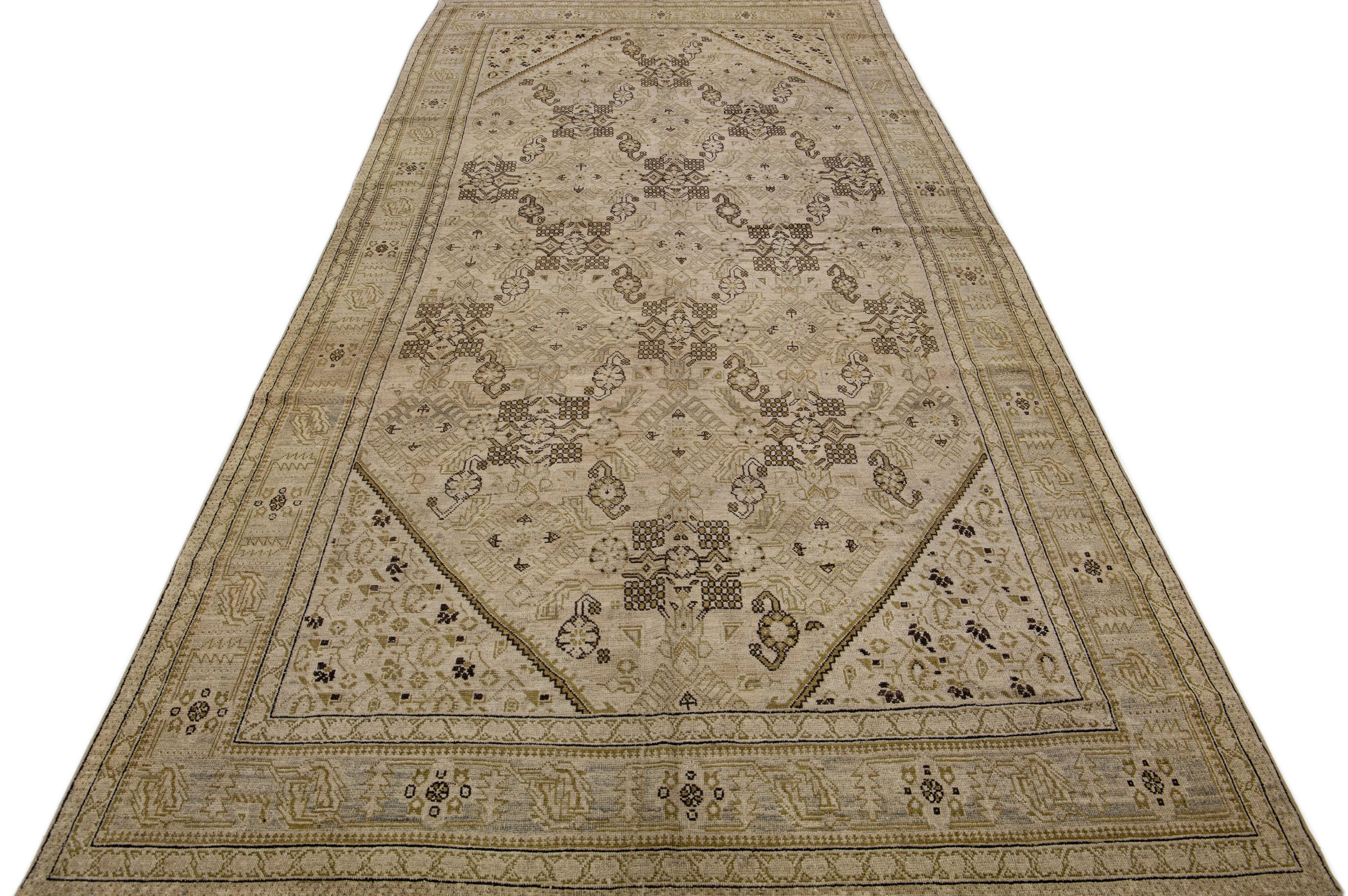 Add antique flair to your decor with this handmade Karabaugh wool area rug. It's the perfect accent piece, boasting a rich beige-tan field and muted tones of an allover floral motif.
 

This rug measures: 6'2