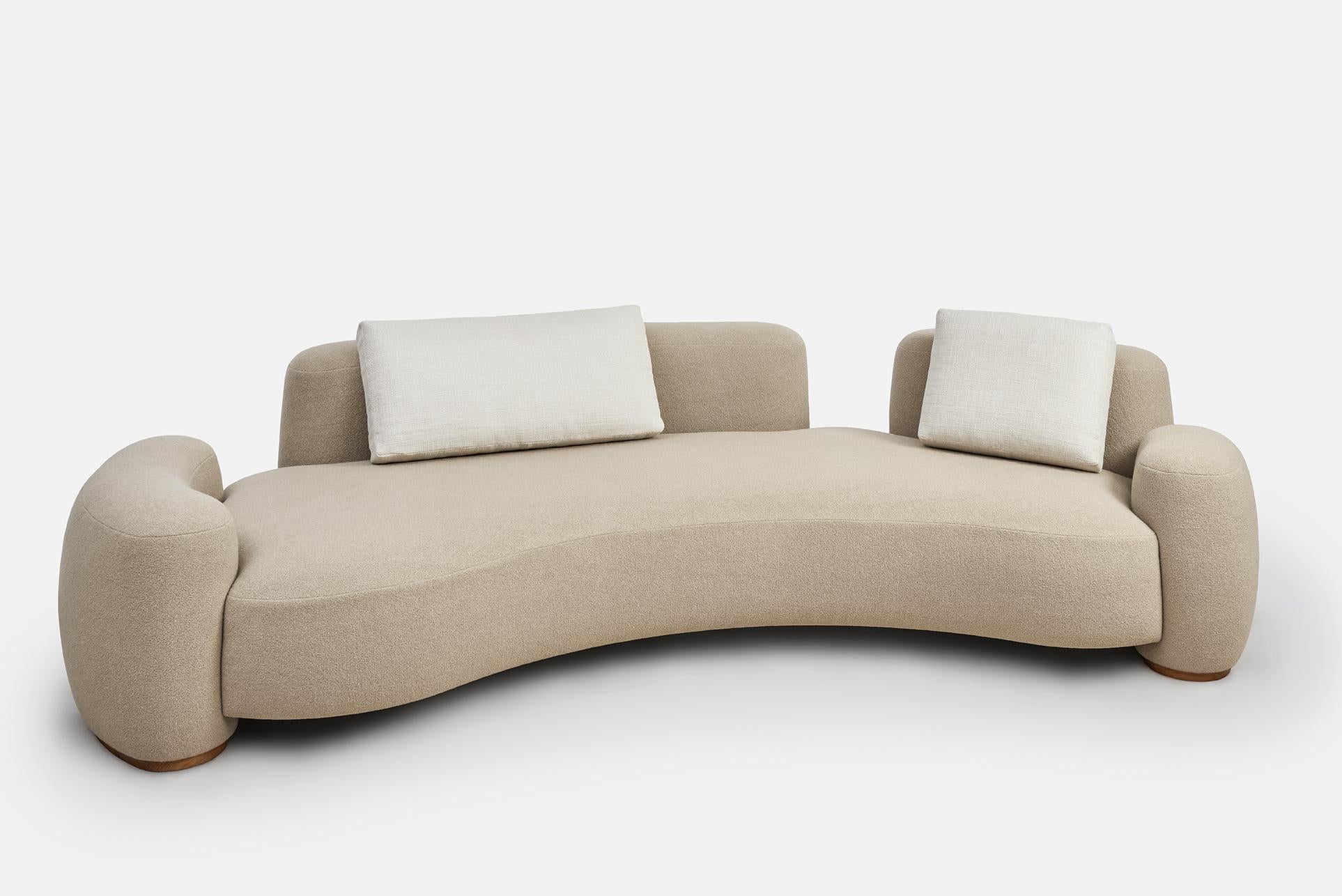Beige baba sofa by Gisbert Pöppler.
Dimensions: H 74 (SH43) x W 303 x D 140.5 cm.
Materials: Upholstered wooden frame, teak footings.

Like a friend that wants to cuddle, Baba is an upholstered sofa series for lounging in complete comfort. The