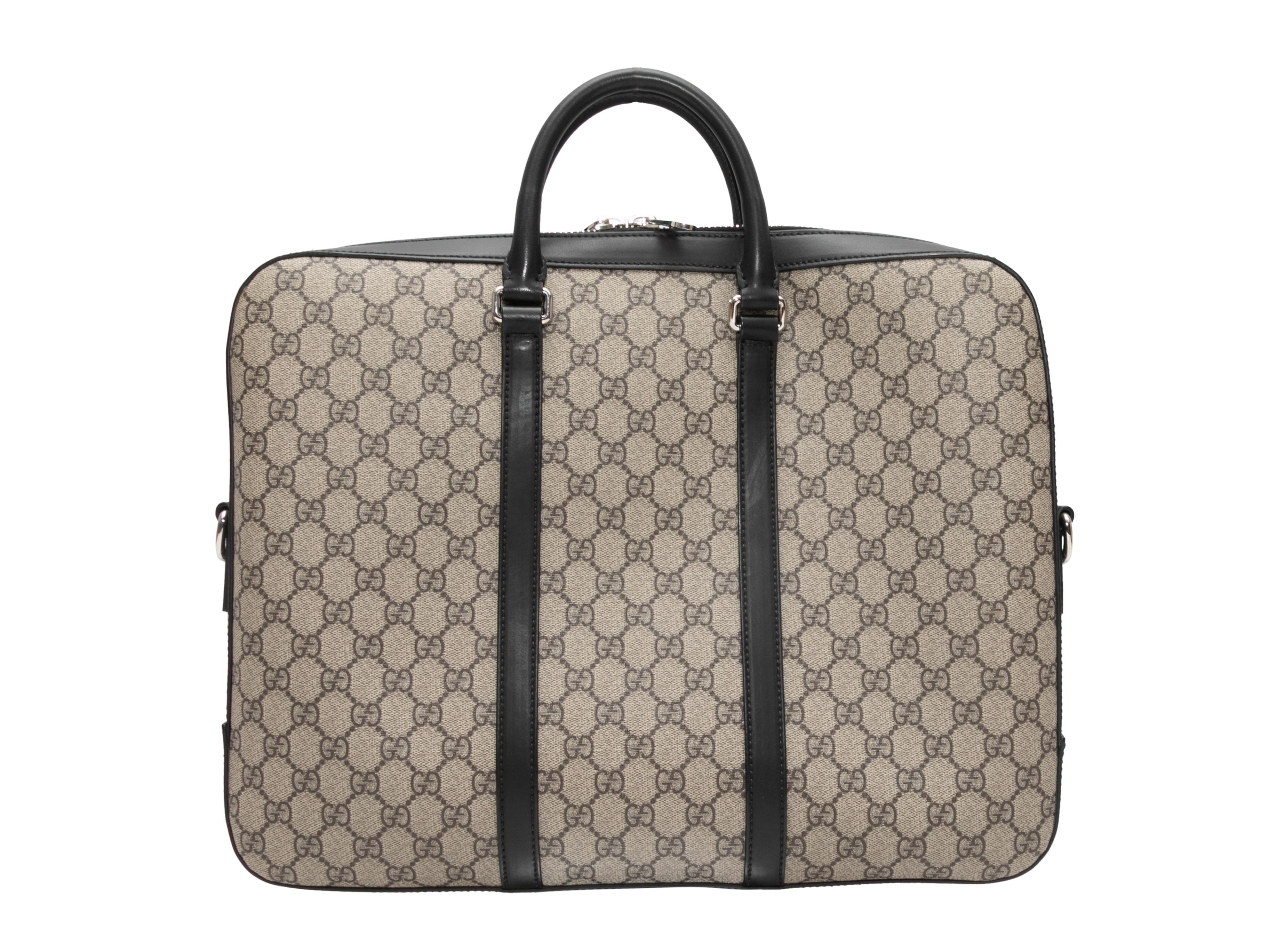 Beige & Black Gucci Monogram Crossbody Briefcase. This briefcase features a coated canvas body, leather trim, silver-tone hardware, dual top handles, a single flat shoulder strap, and a top zip closure. 16.5