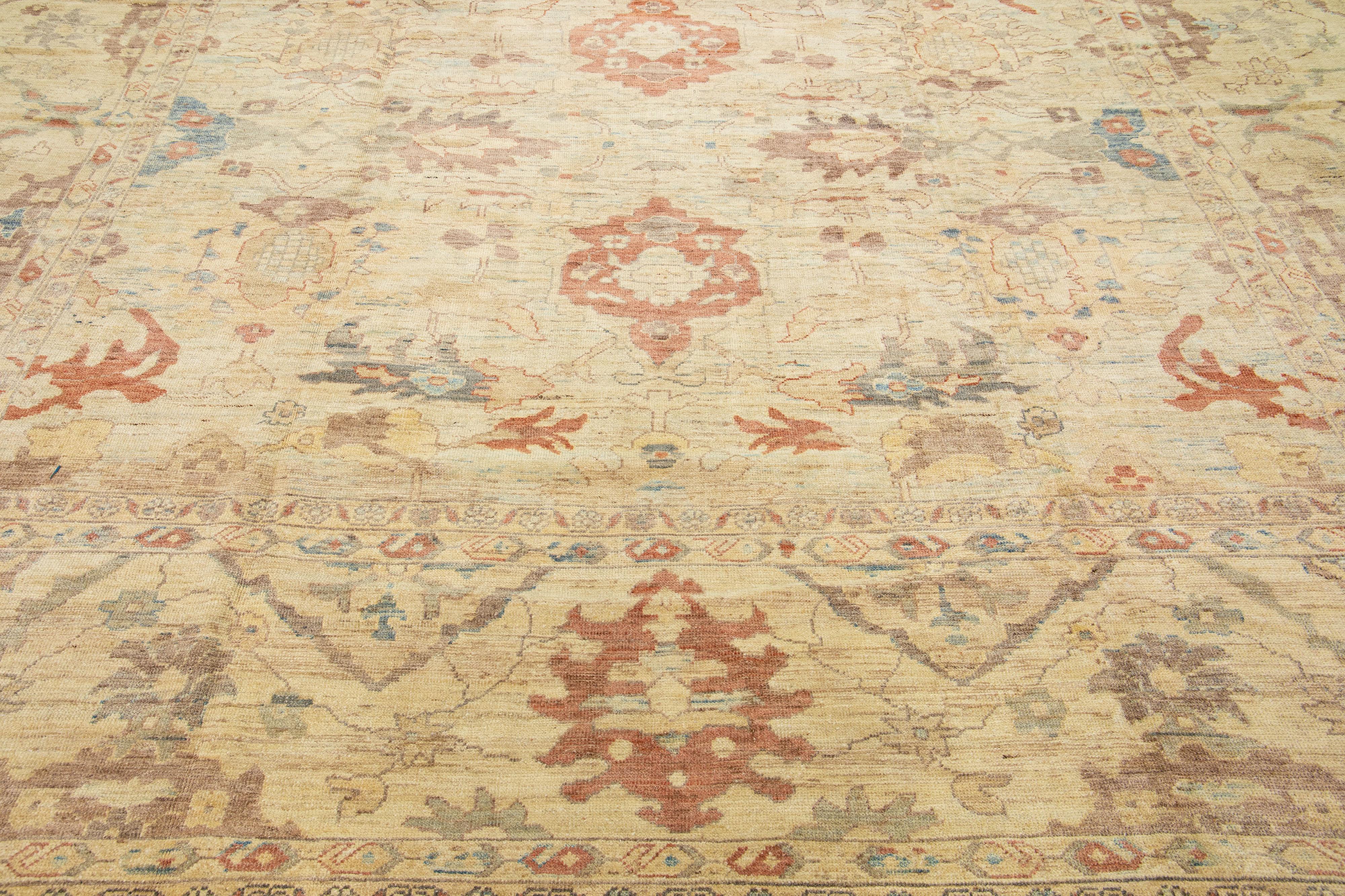 Beautiful modern Sultanabad hand-knotted wool rug with a blue color field. This rug has a designed frame with rust-orange and brown accents in a gorgeous all-over floral design.

This rug measures: 13' x 18'7
