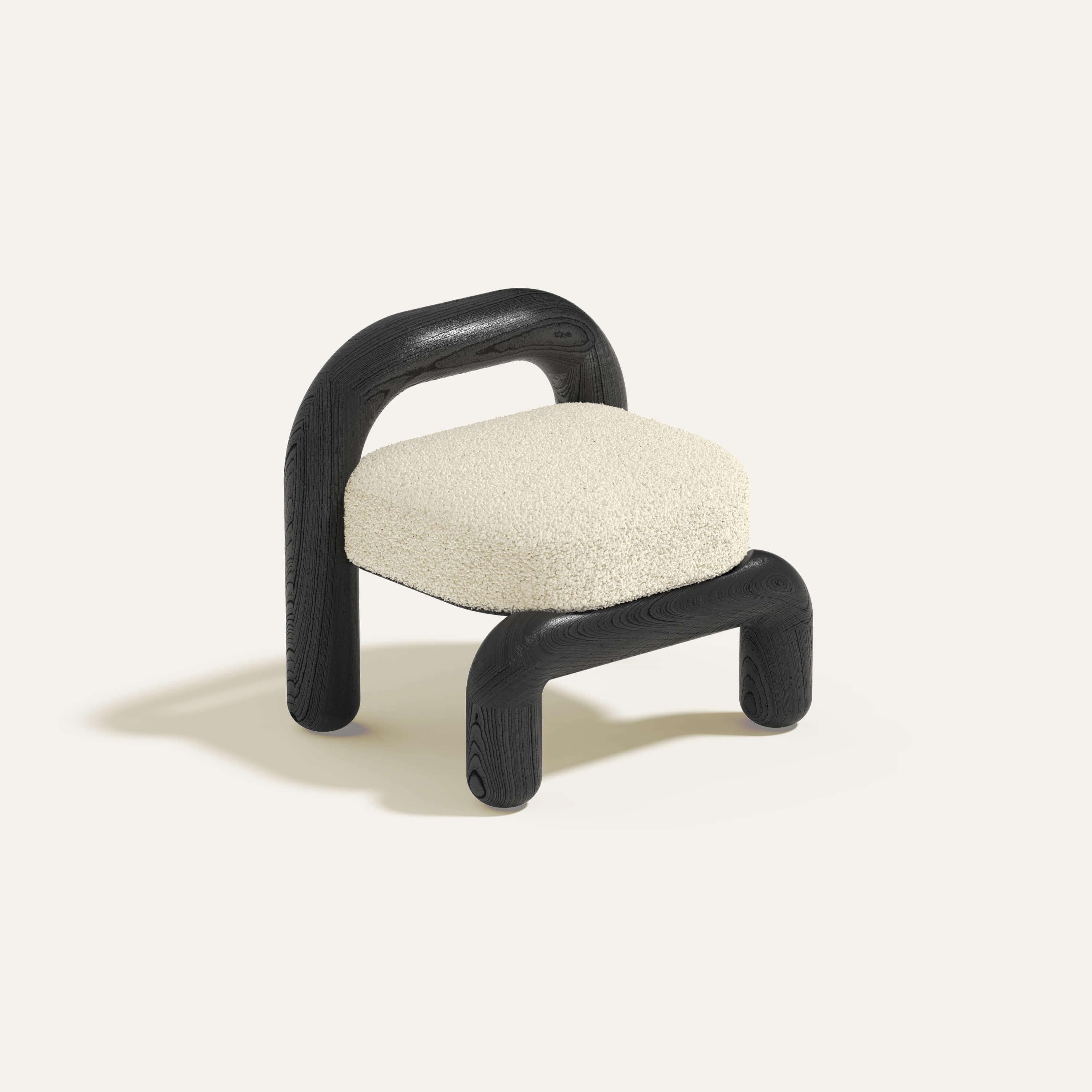Beige Boucle Black Oak Lithic Lounge Chair by Maha Alavi Studio
Dimensions : L 74 x D 59 x H 71 cm
MATERIAL : Chêne massif.

Maha Alavi est une designer industrielle canadienne basée à Tokyo. Sa pratique vise à explorer le contexte par le biais de