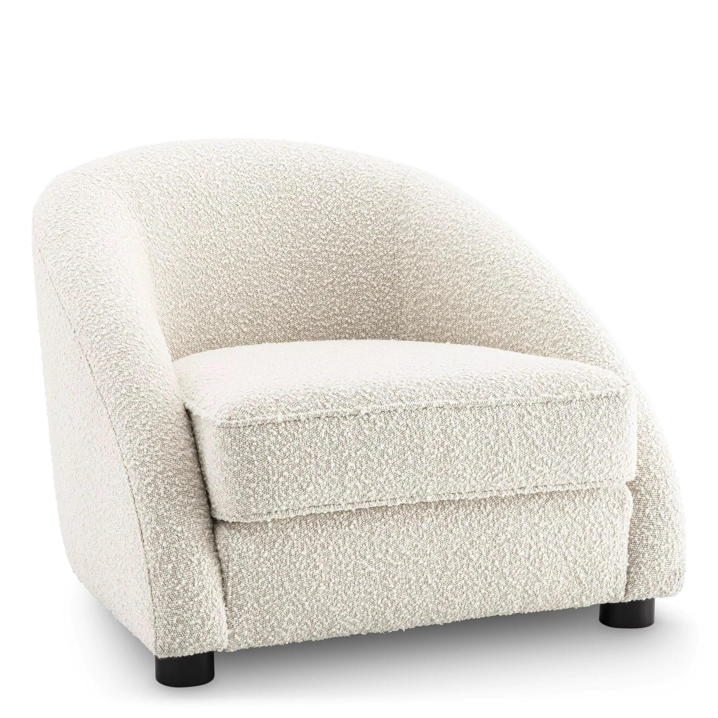 Welcoming and curved armchair in beige bouclé fabric with black wooden feet.